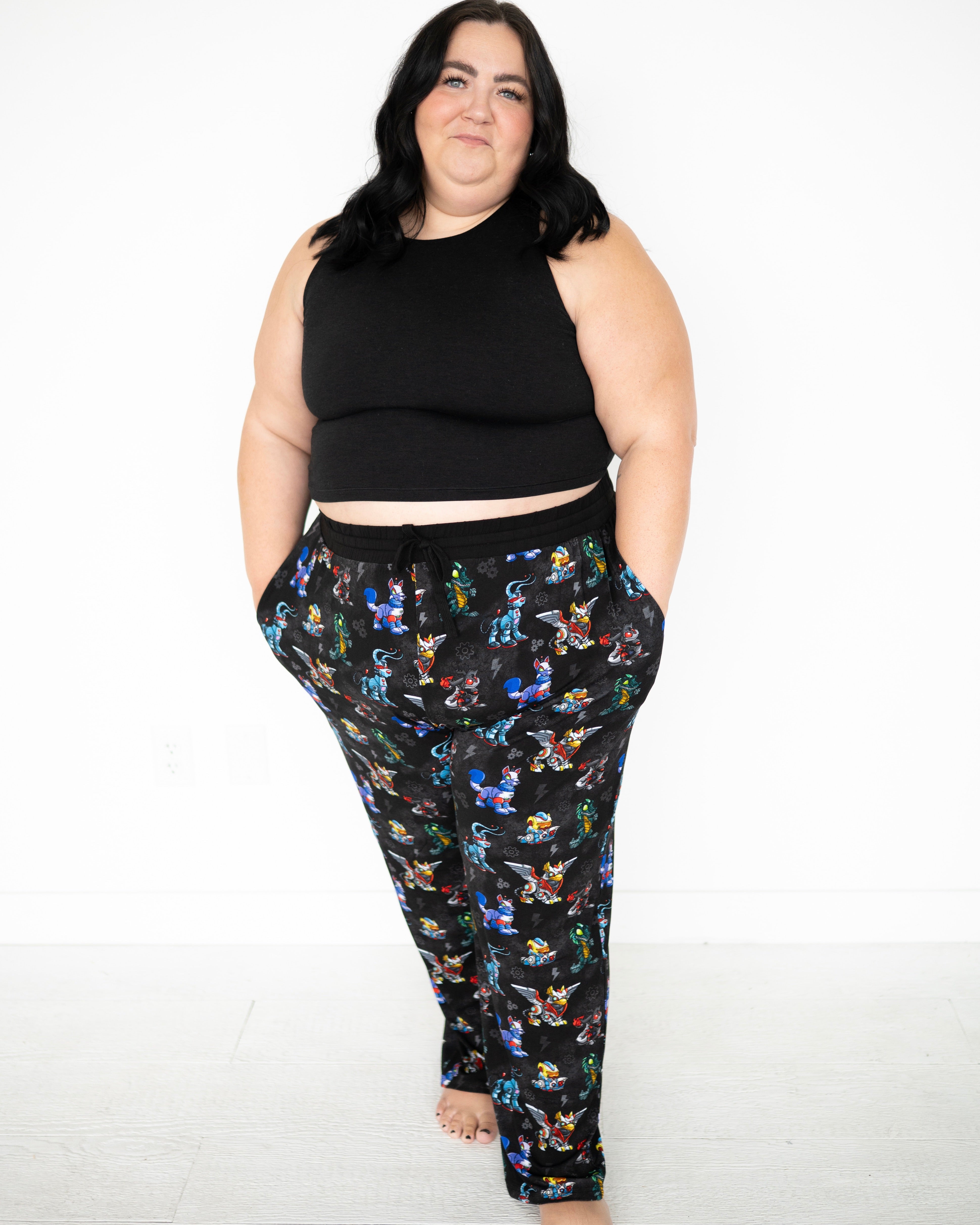 Unisex adult sleep pant with a black background and colorful Neopets robot pattern.