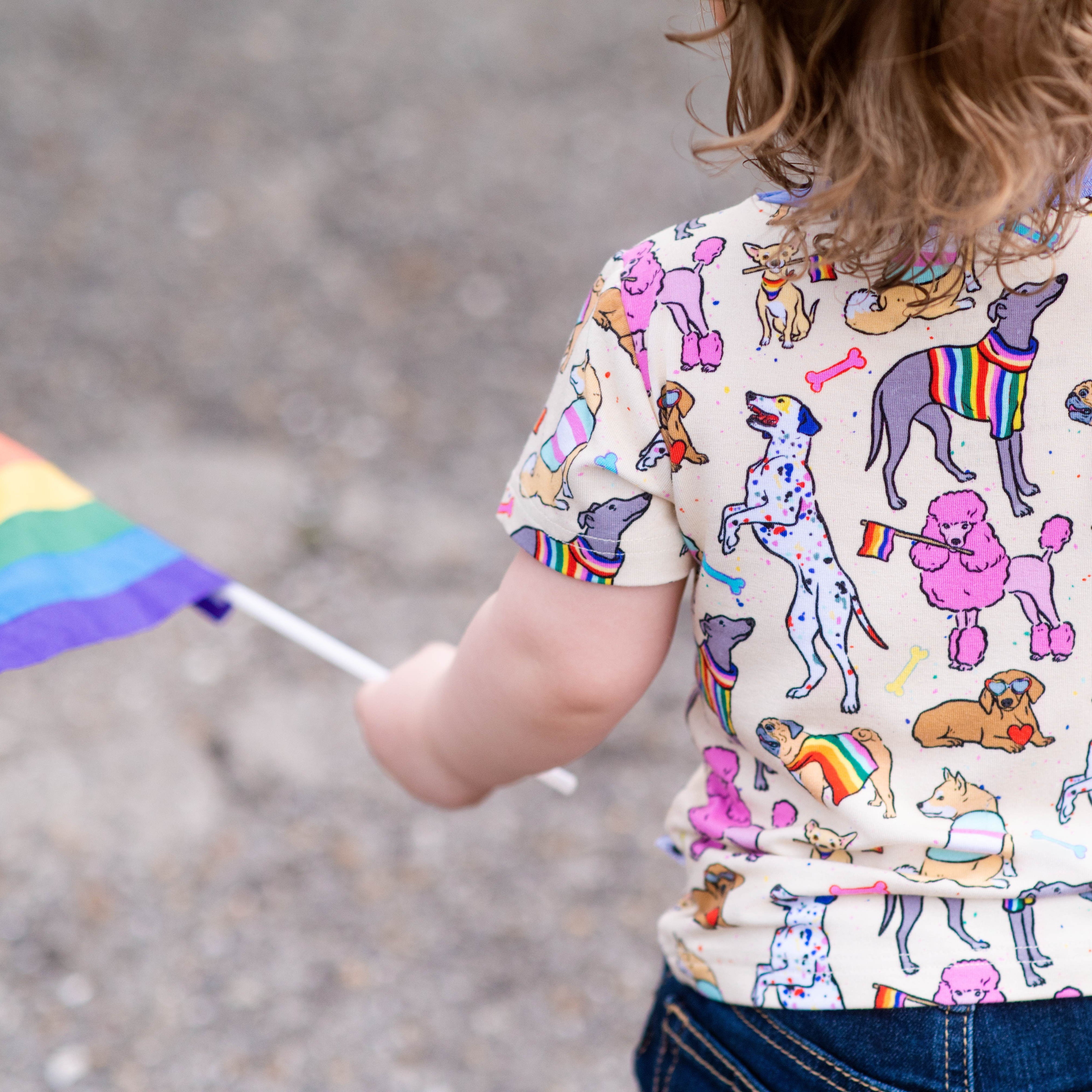 Kids t-shirt with a print of rainbow-colored dogs.