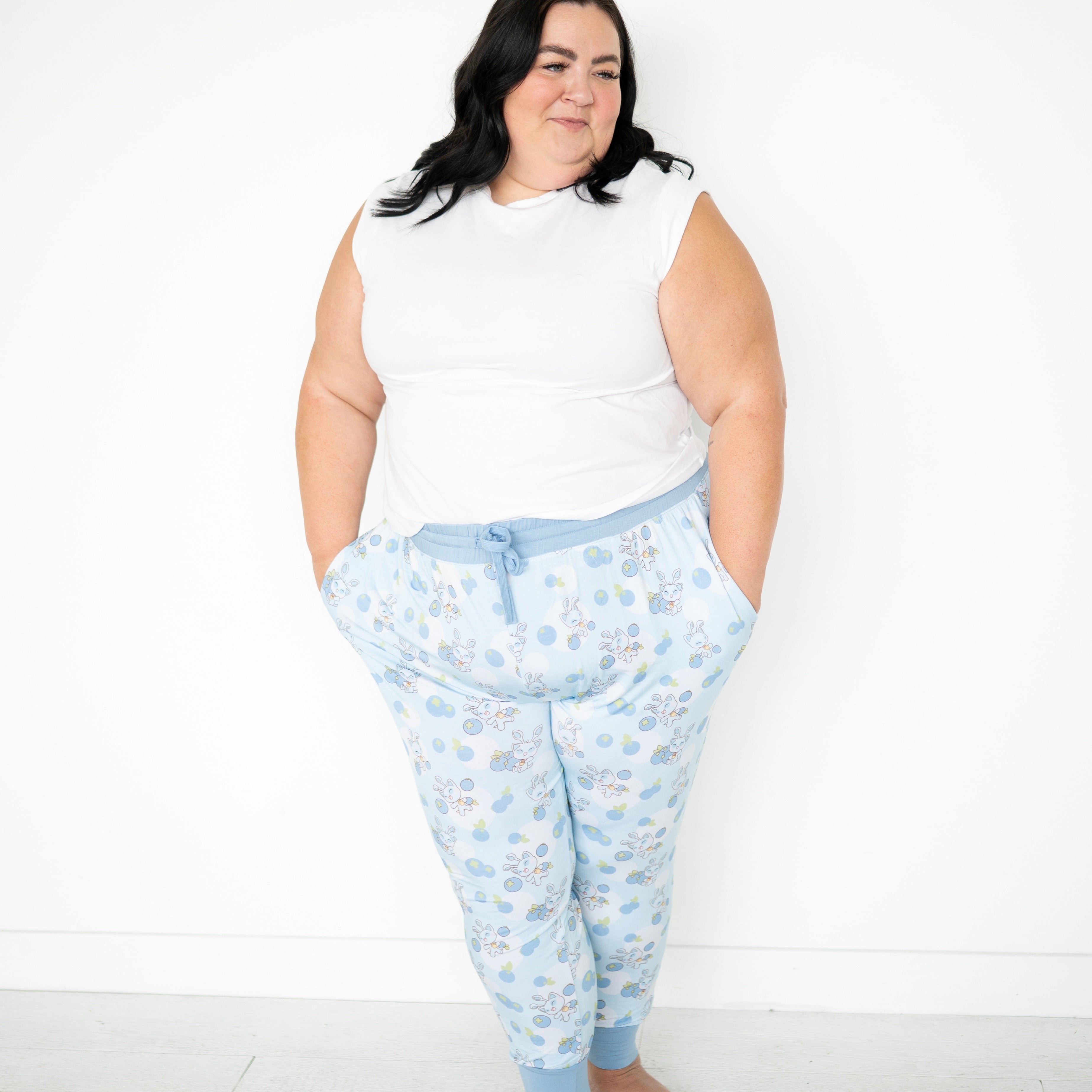 Women's light blue joggers with a blueberry and baby Aisha print.