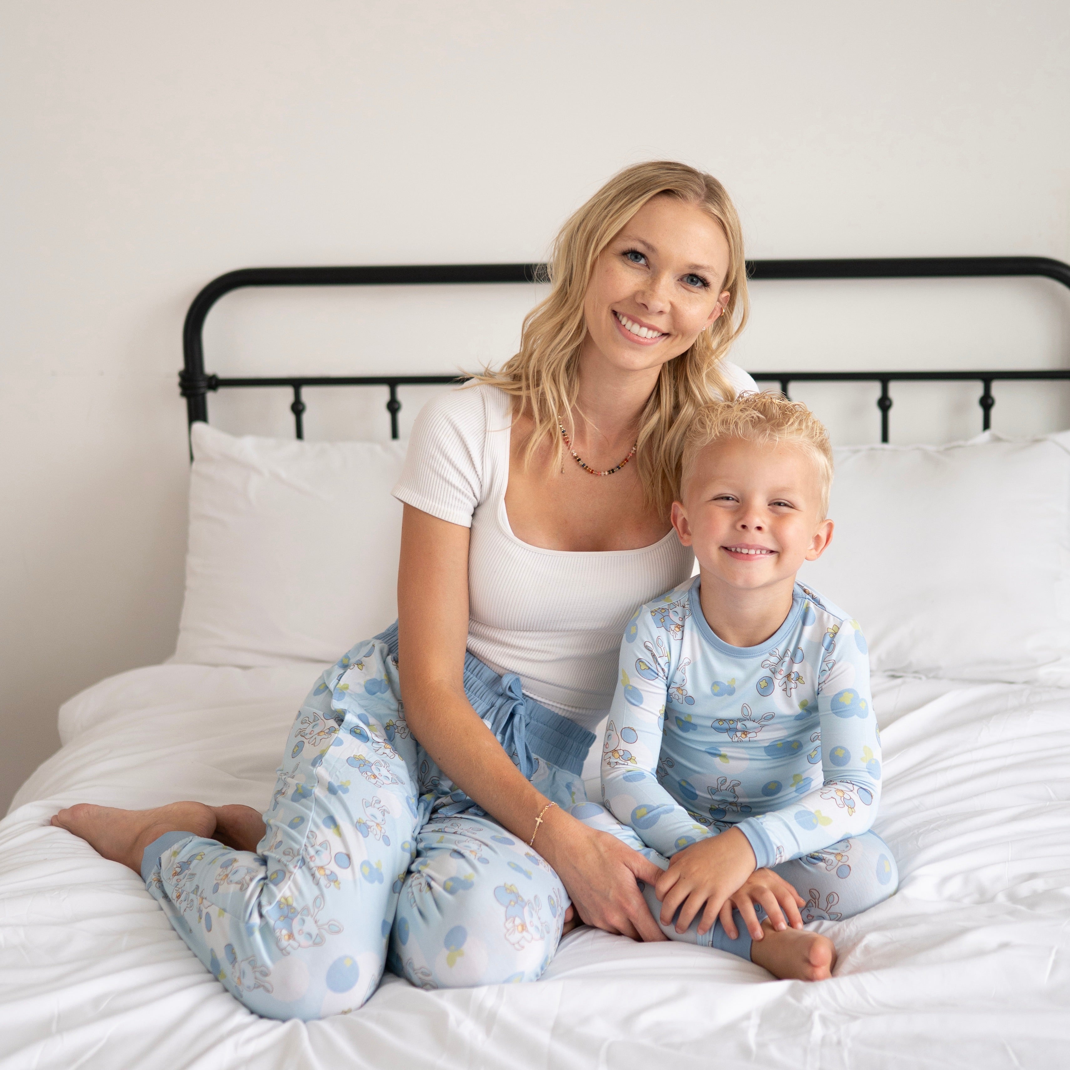 Women's Neopets Blueberry Baby print joggers with a white ribbed tank top.