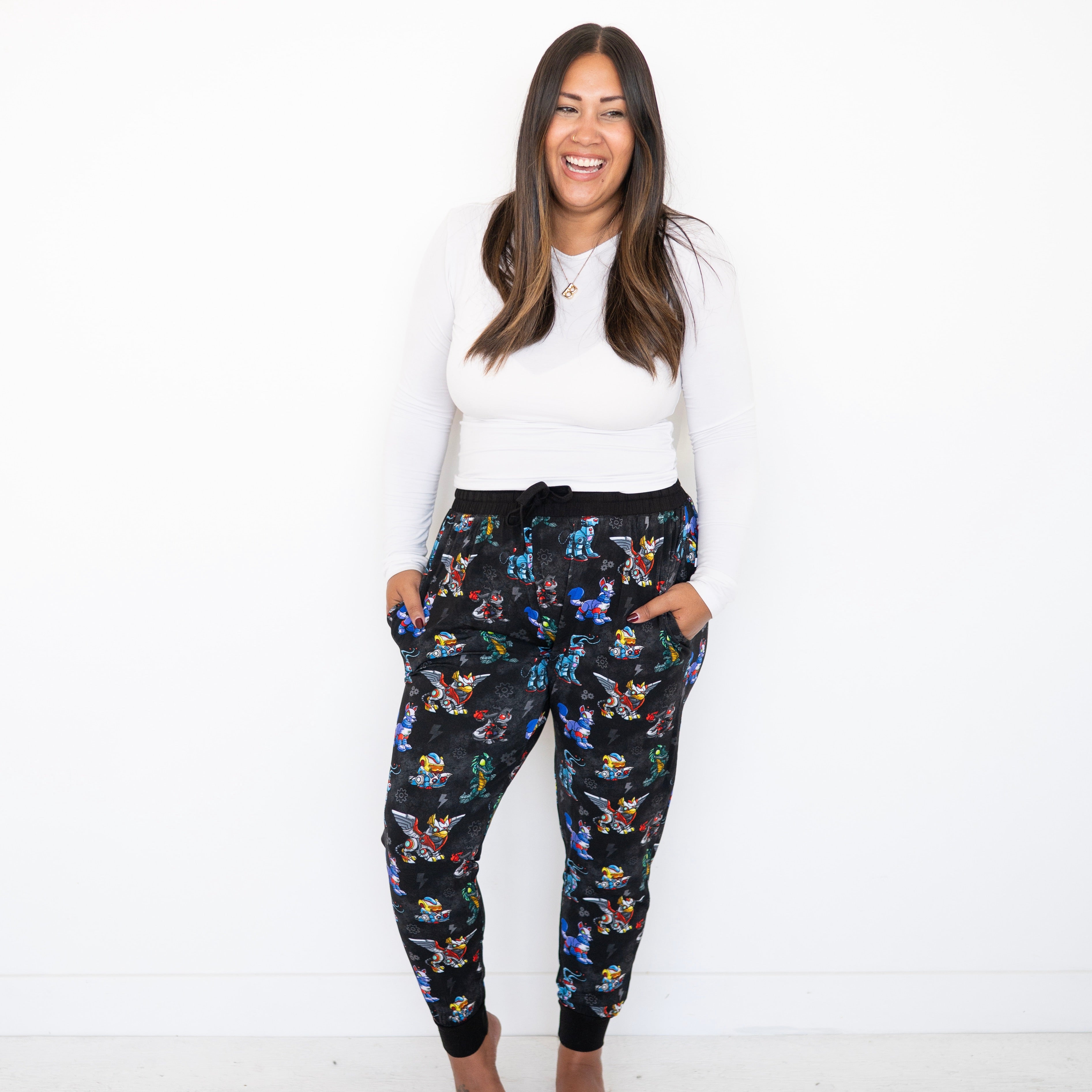 Women's black jogger pants with a Neopets robot print.