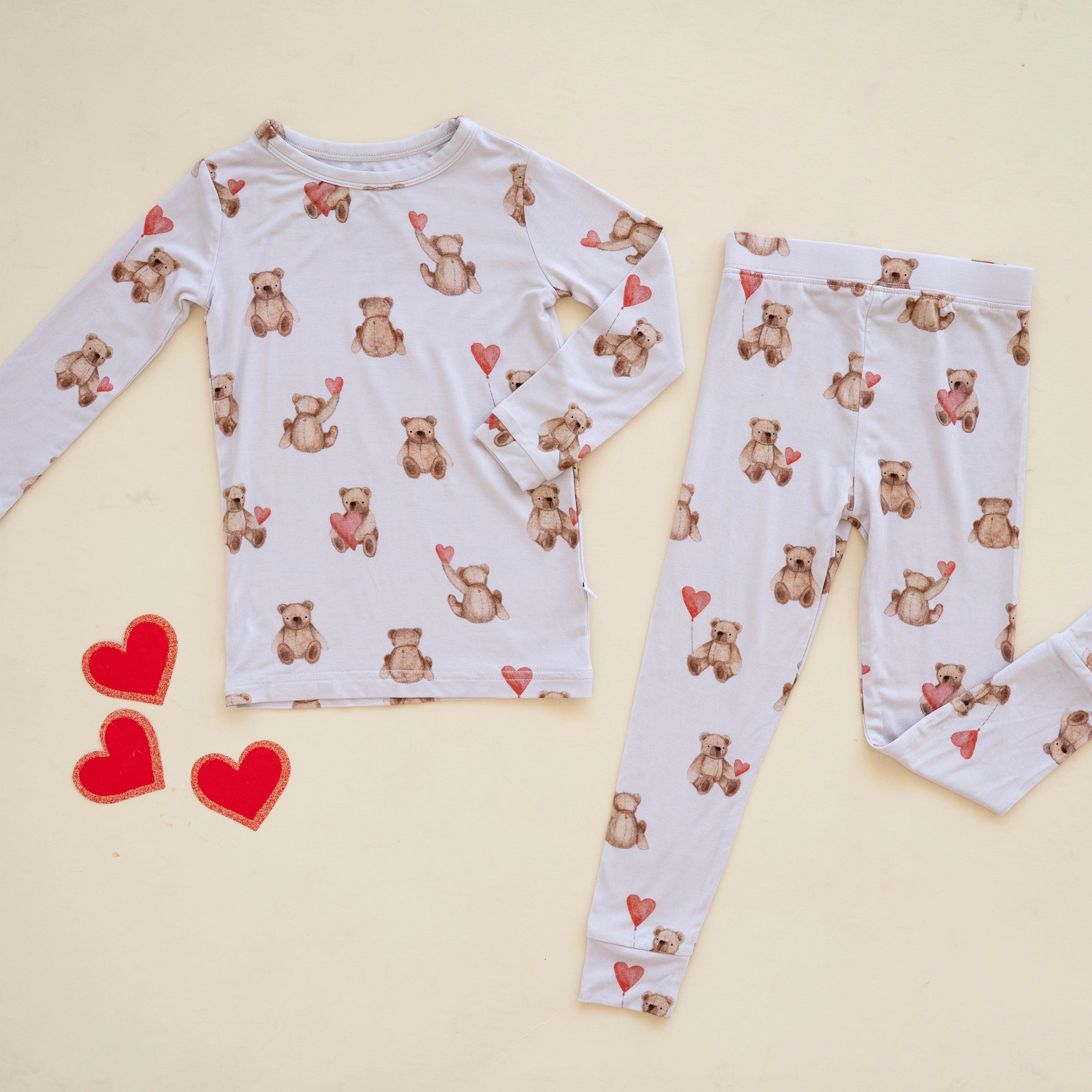 Lightweight pajamas with a teddy bear and heart print.
