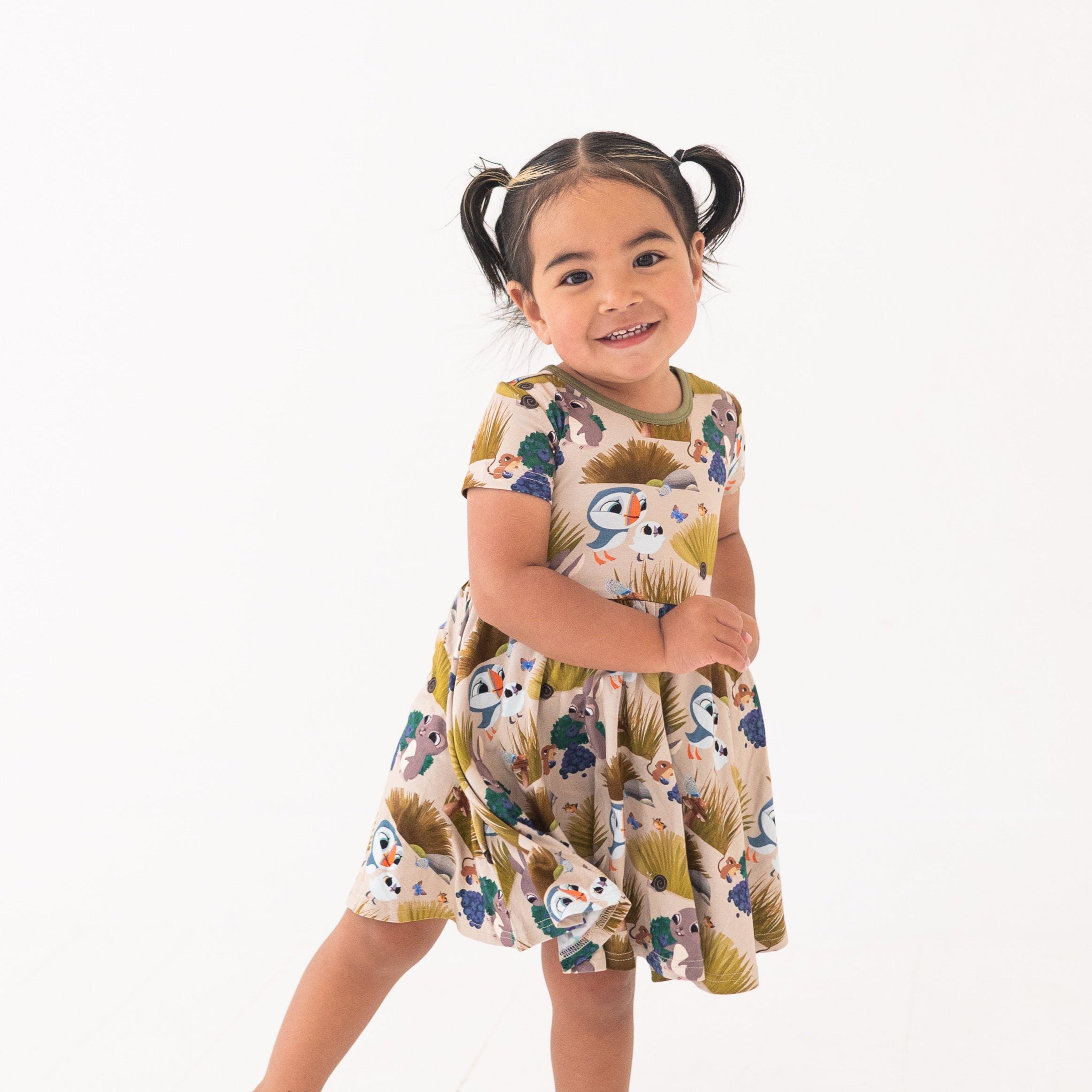 Puffin Rock™ bamboo dress with a puffin and nature print.