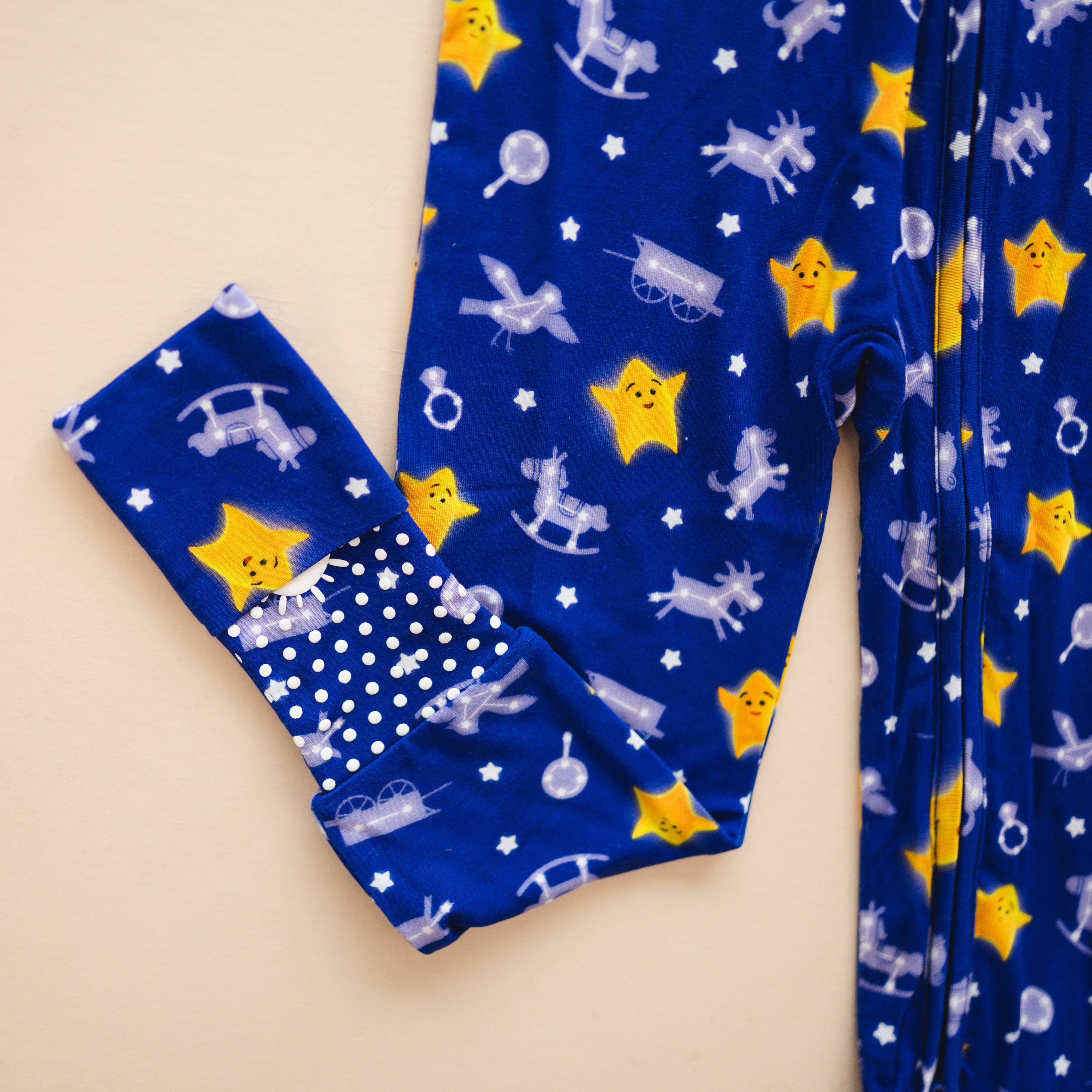 Blue bamboo pajamas with a Juno the Star print and polka dot cuff.
