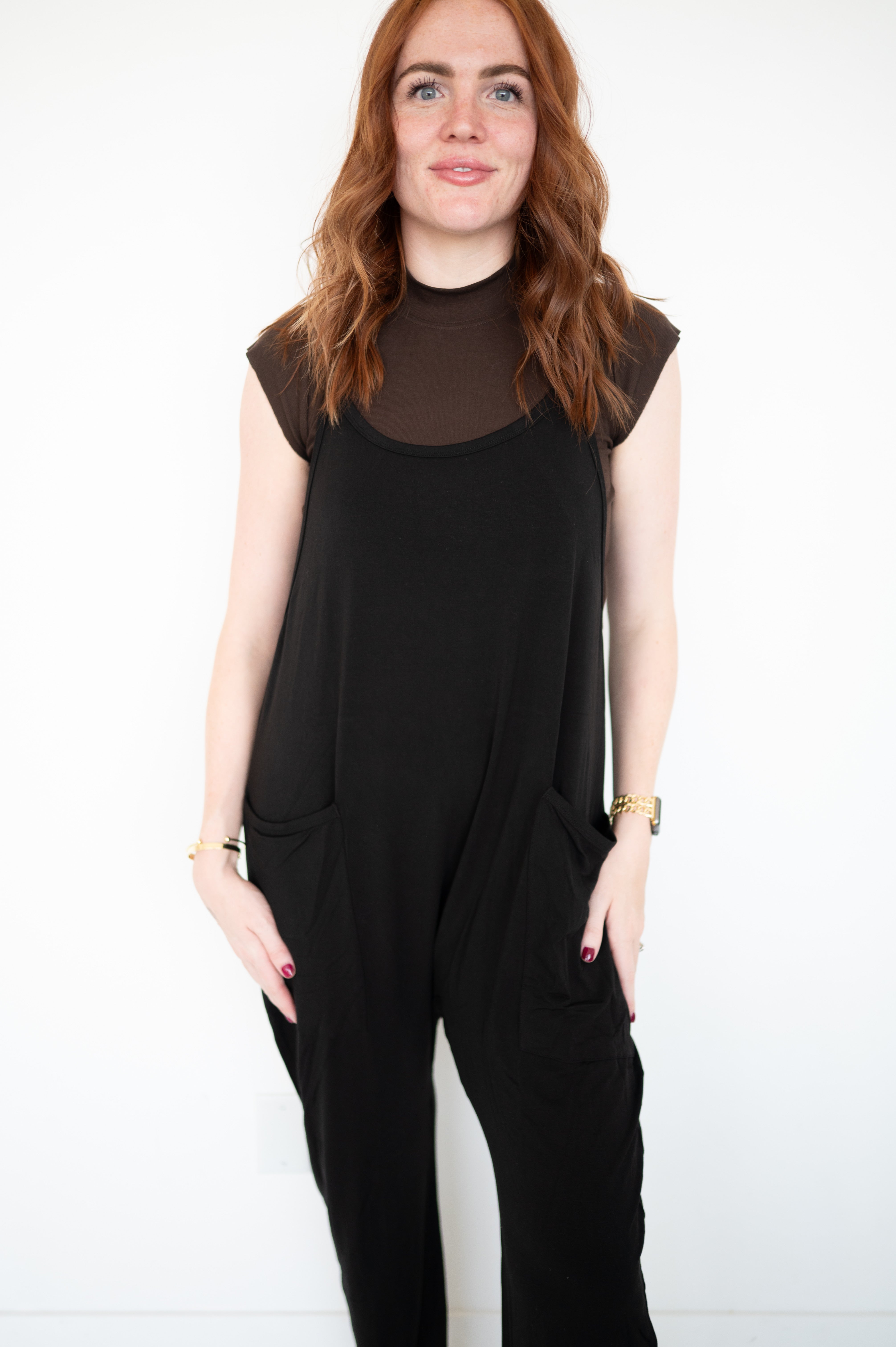 Adult overalls in obsidian made of luxe bamboo with a racerback and oversized pockets.