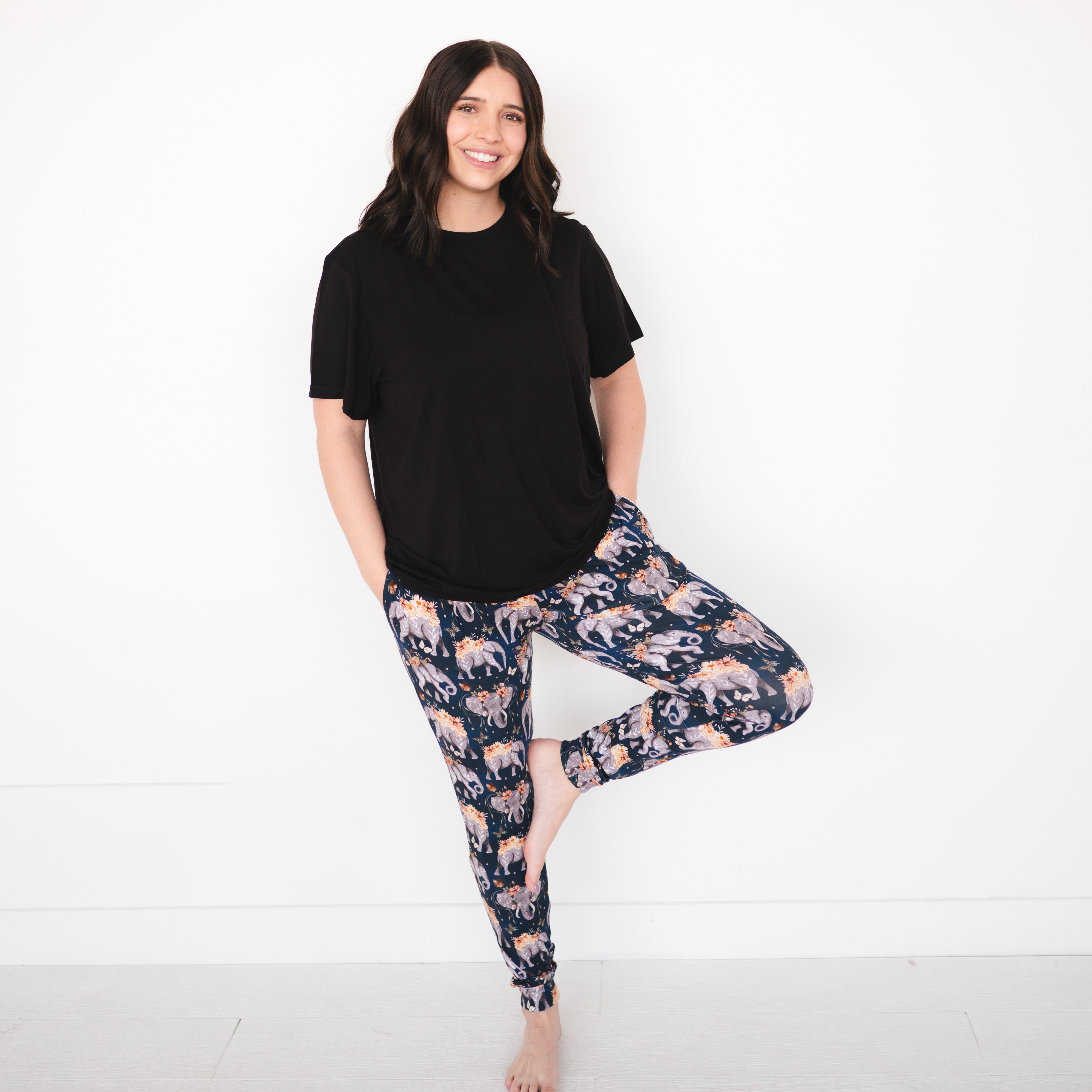 Women's black t-shirt and navy joggers with an elephant and floral print.