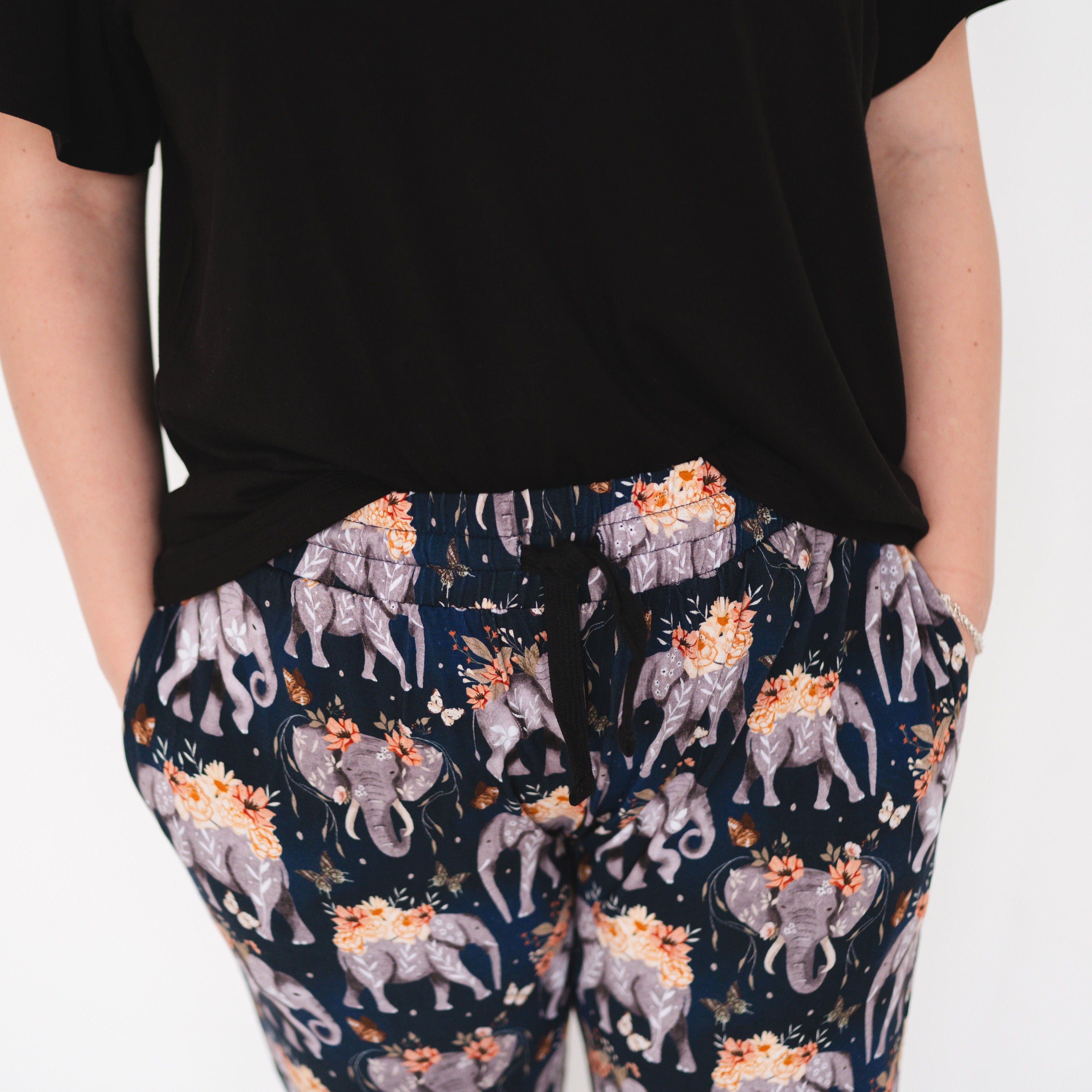Women's black t-shirt and navy joggers with an elephant and floral print.