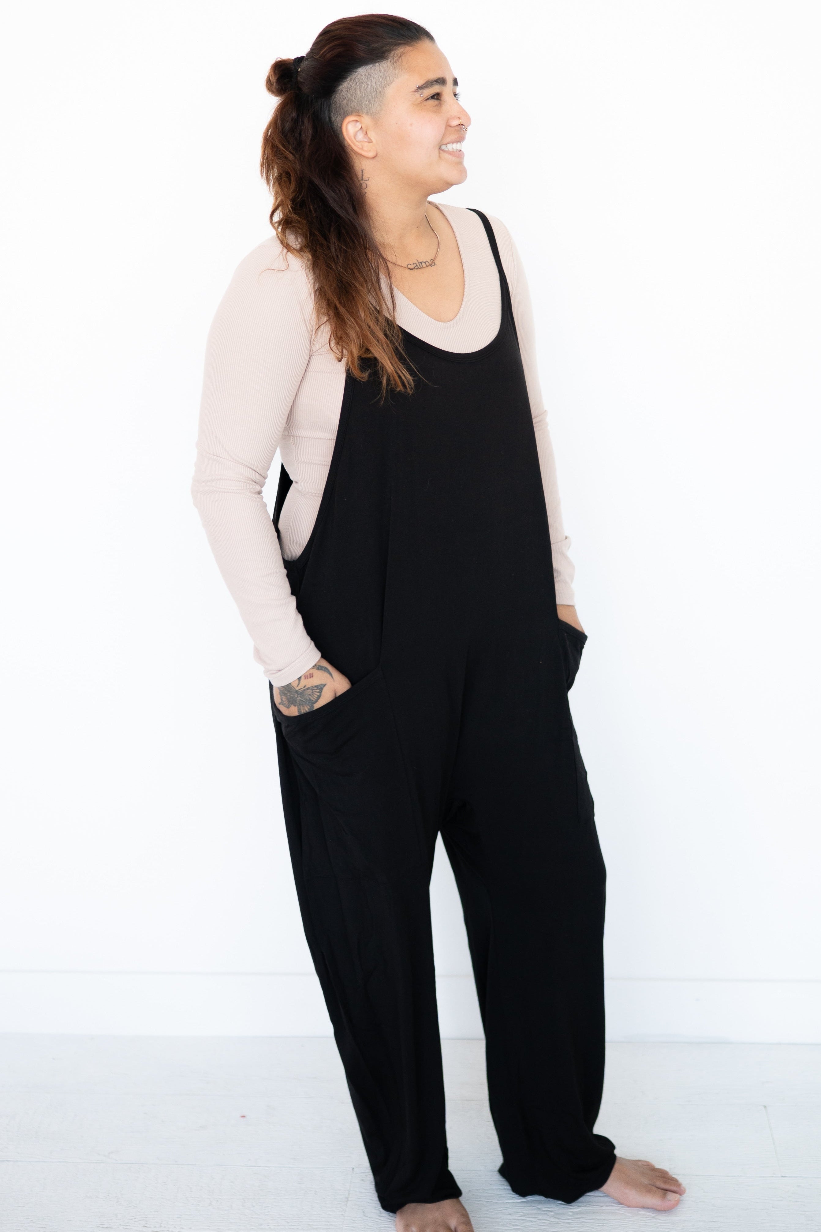 Adult overalls in obsidian black luxe bamboo with a racerback and oversized pockets.