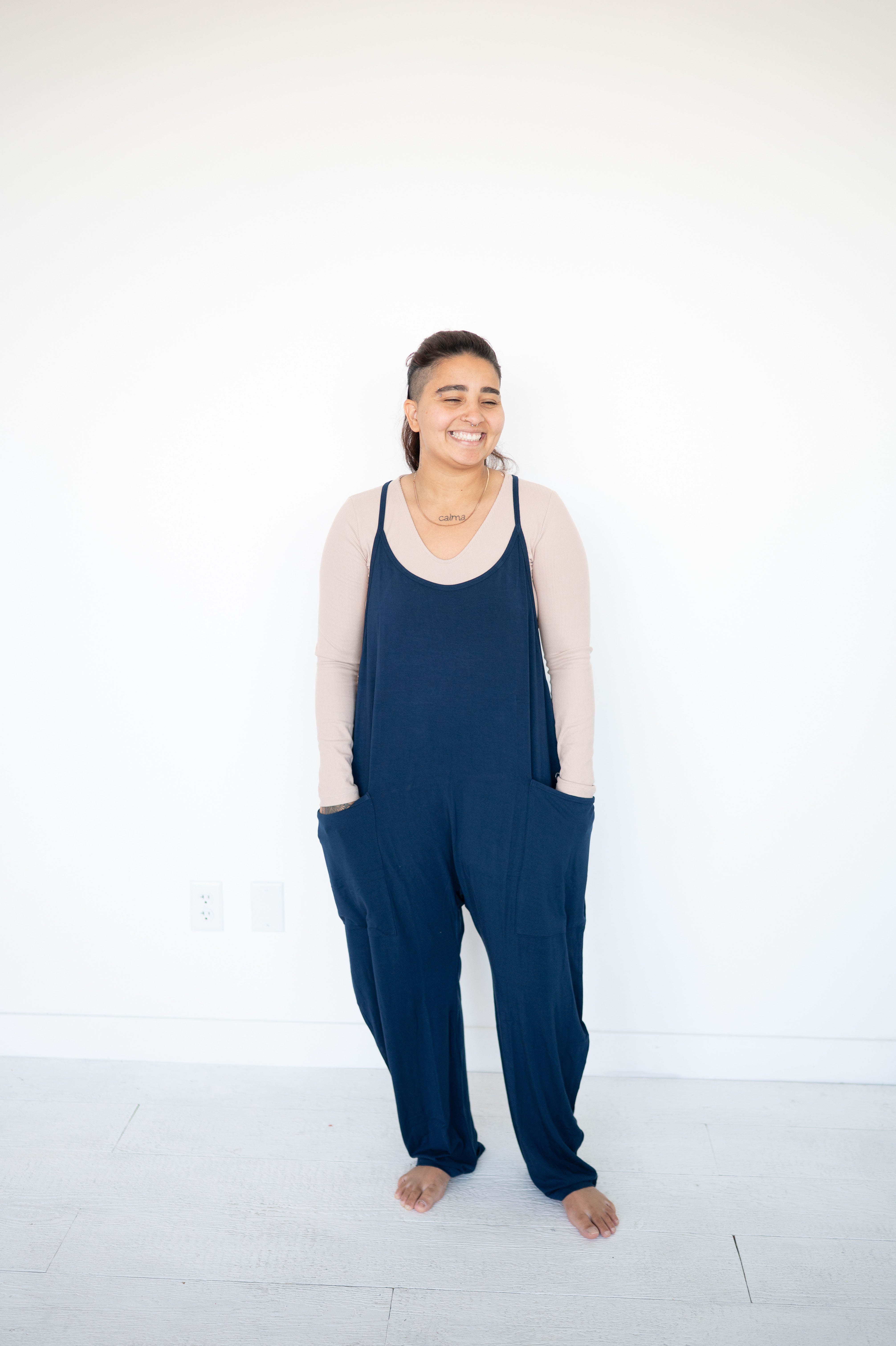 Adult navy overalls made of luxe bamboo fabric with oversized pockets.
