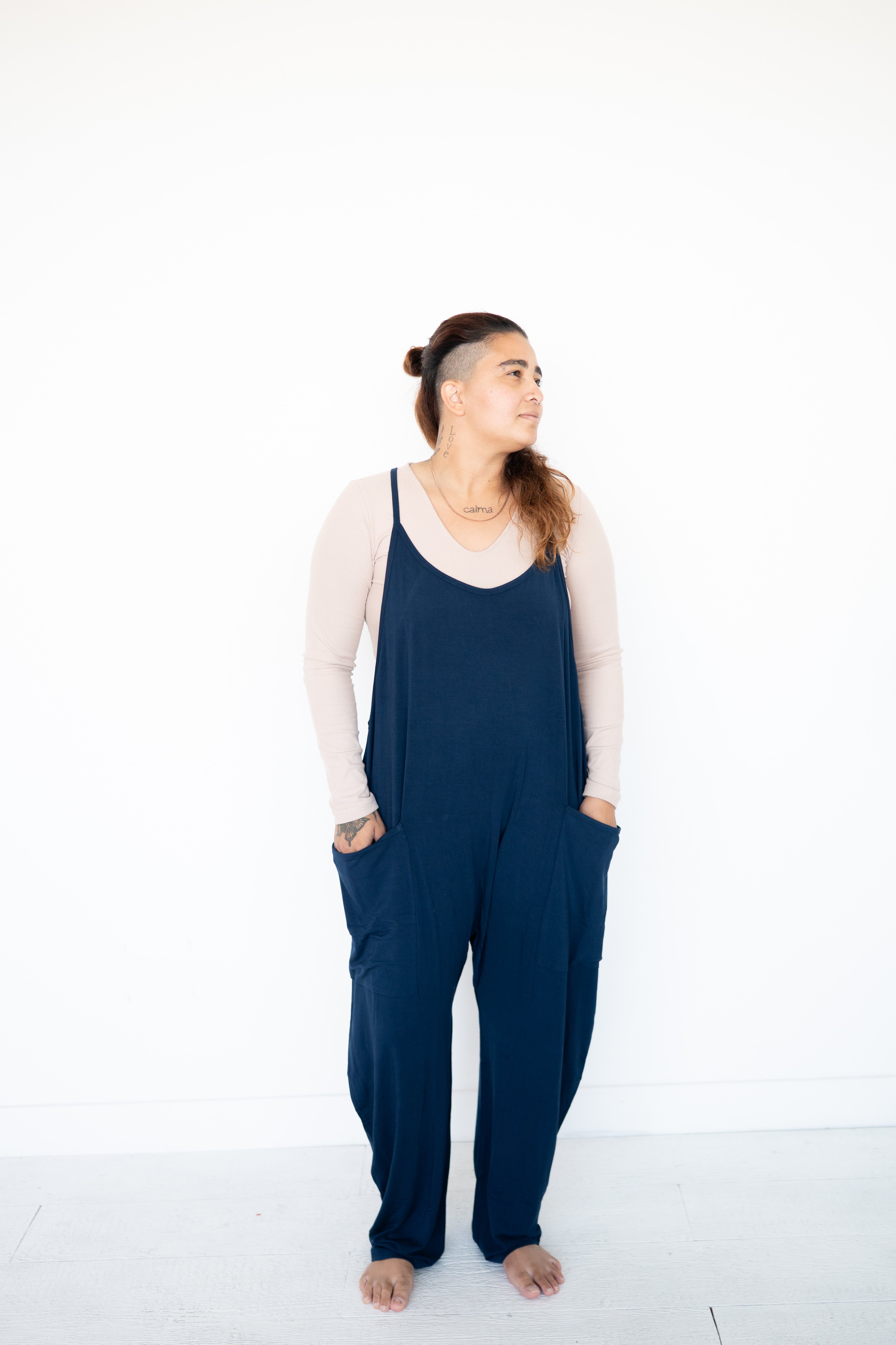 Adult navy overalls made from luxe bamboo fabric with oversized pockets.