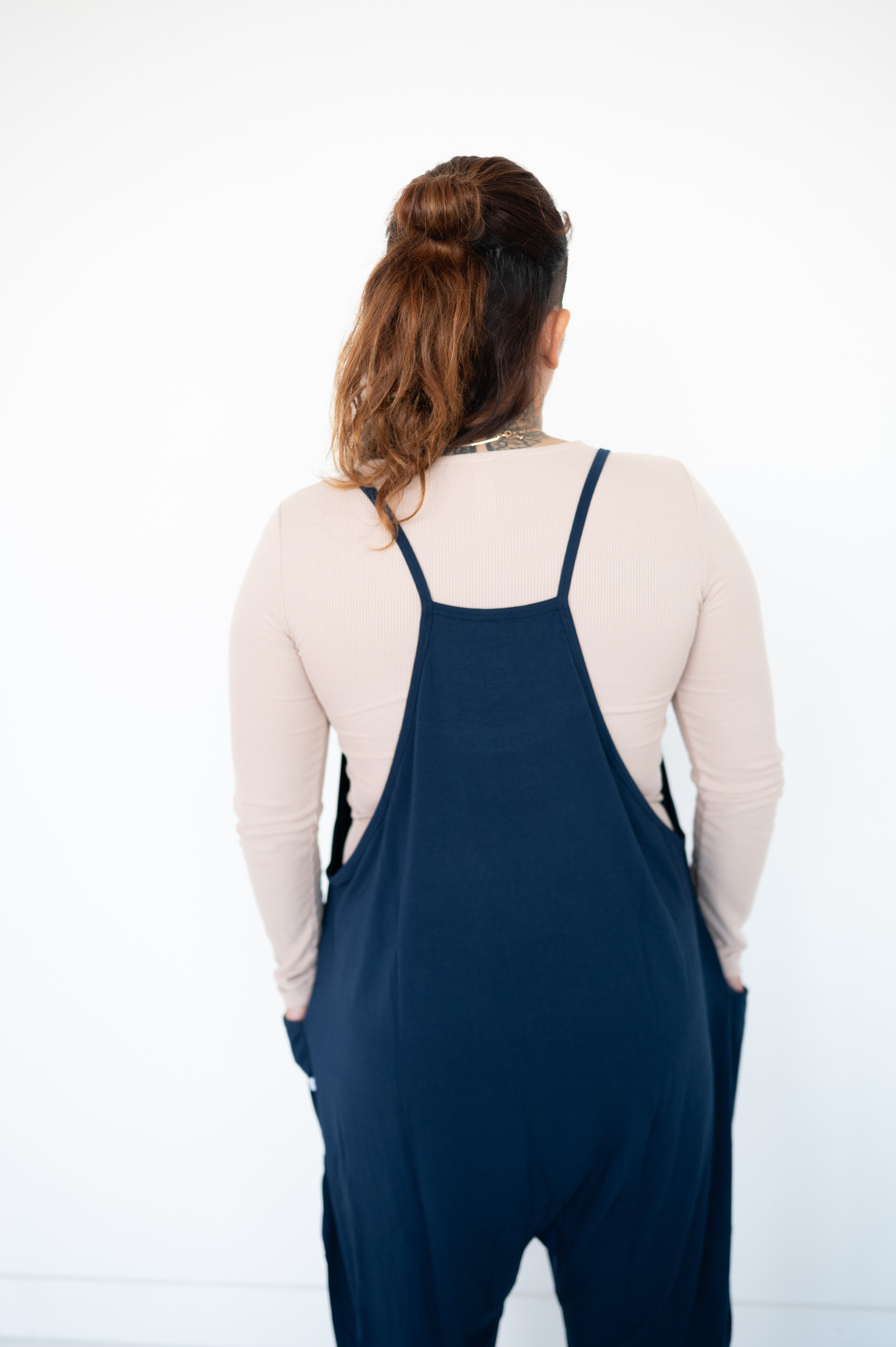 Adult navy overalls made from soft bamboo fabric with pockets.