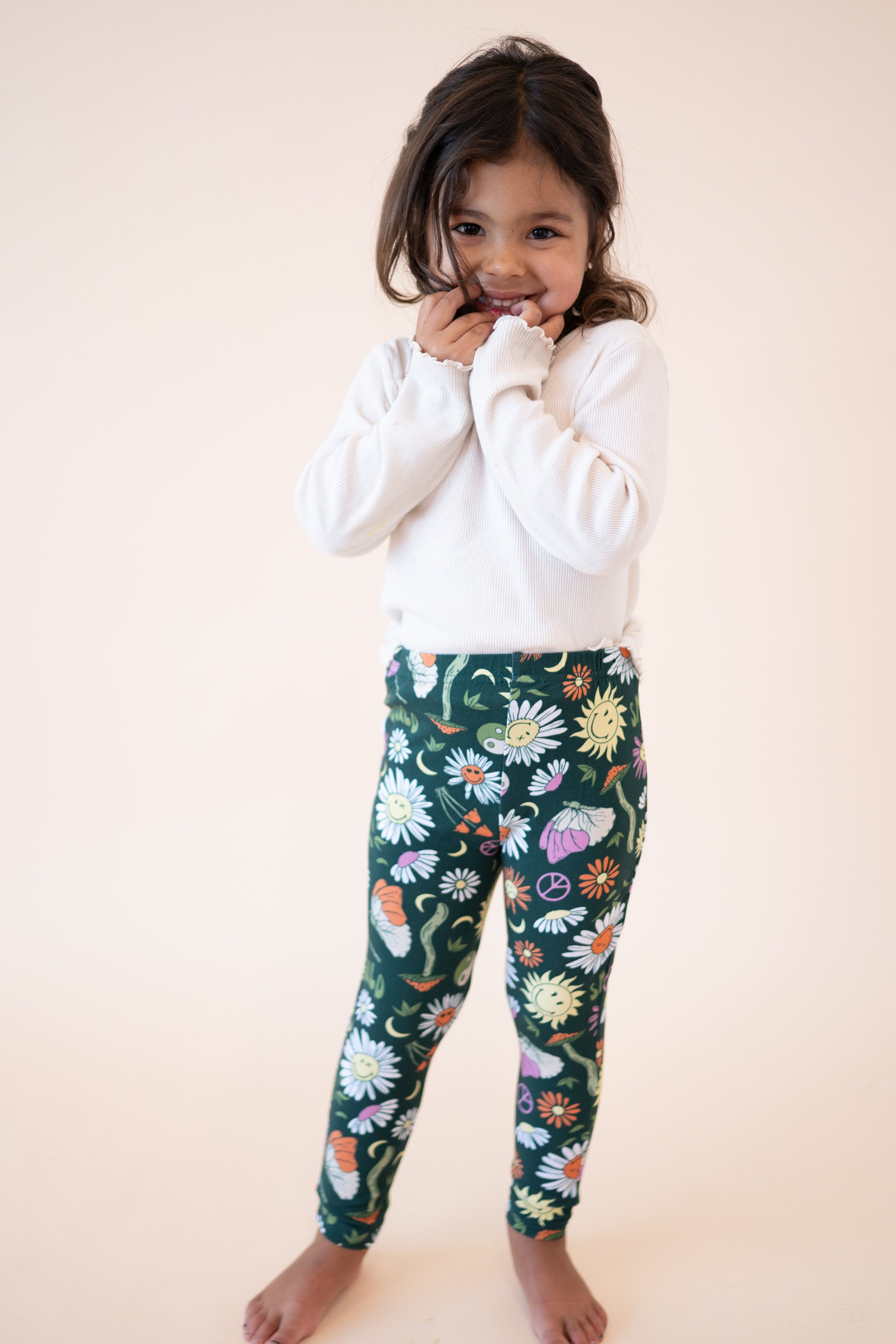 Luxe bamboo leggings with a green groovy floral SmileyWorld print.