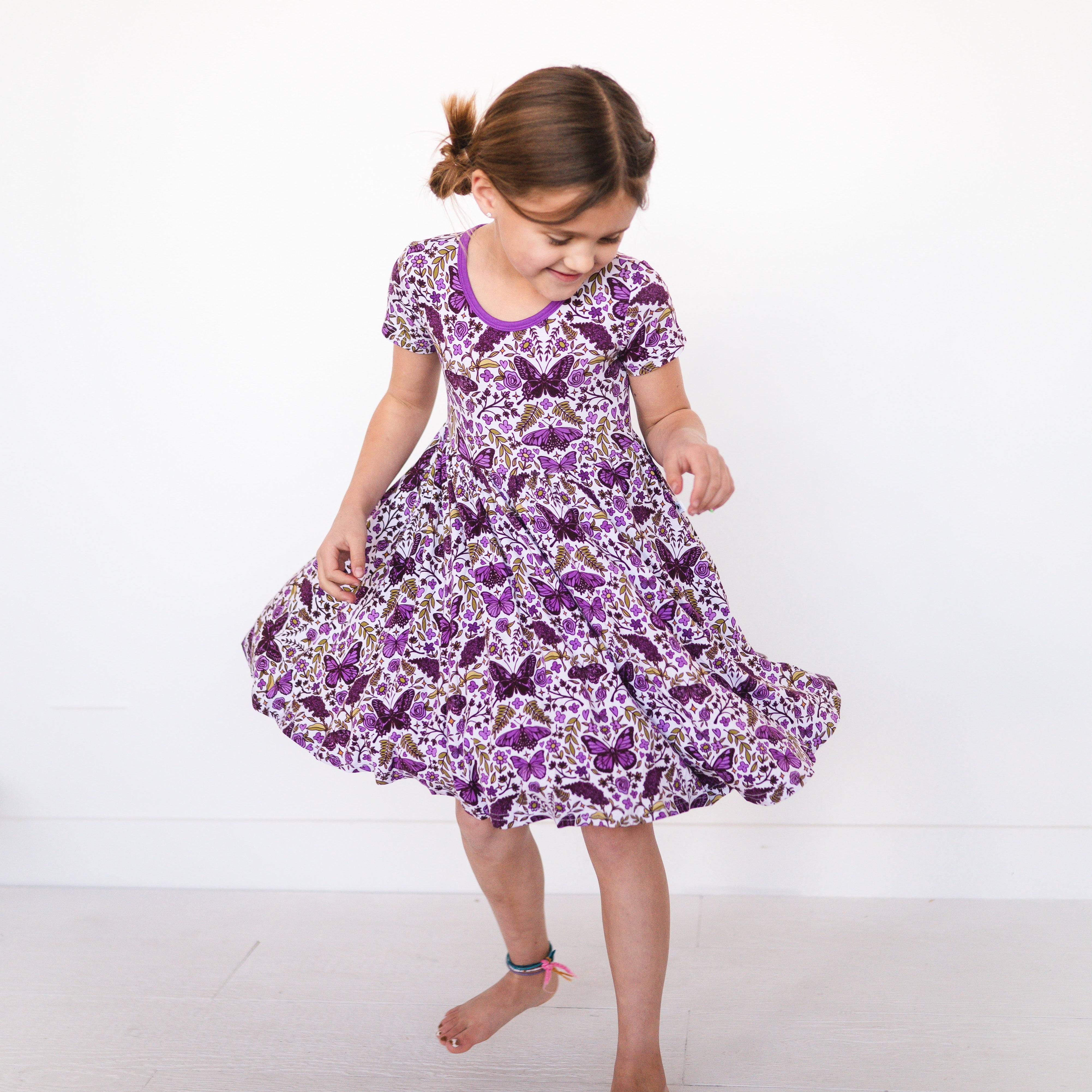 Girl's purple butterfly garden print bamboo dress.