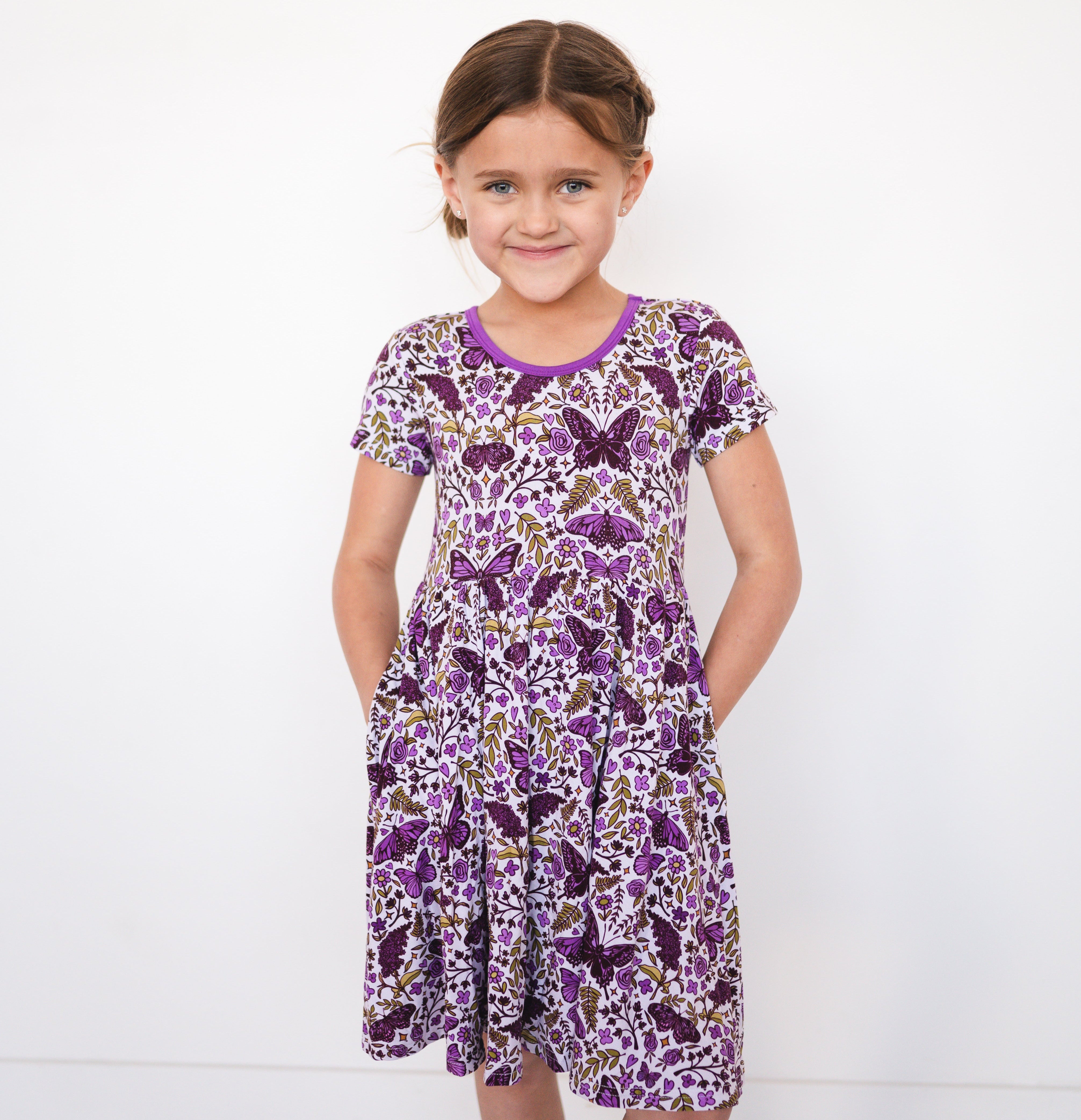 Girl's purple butterfly garden print bamboo dress with pockets.