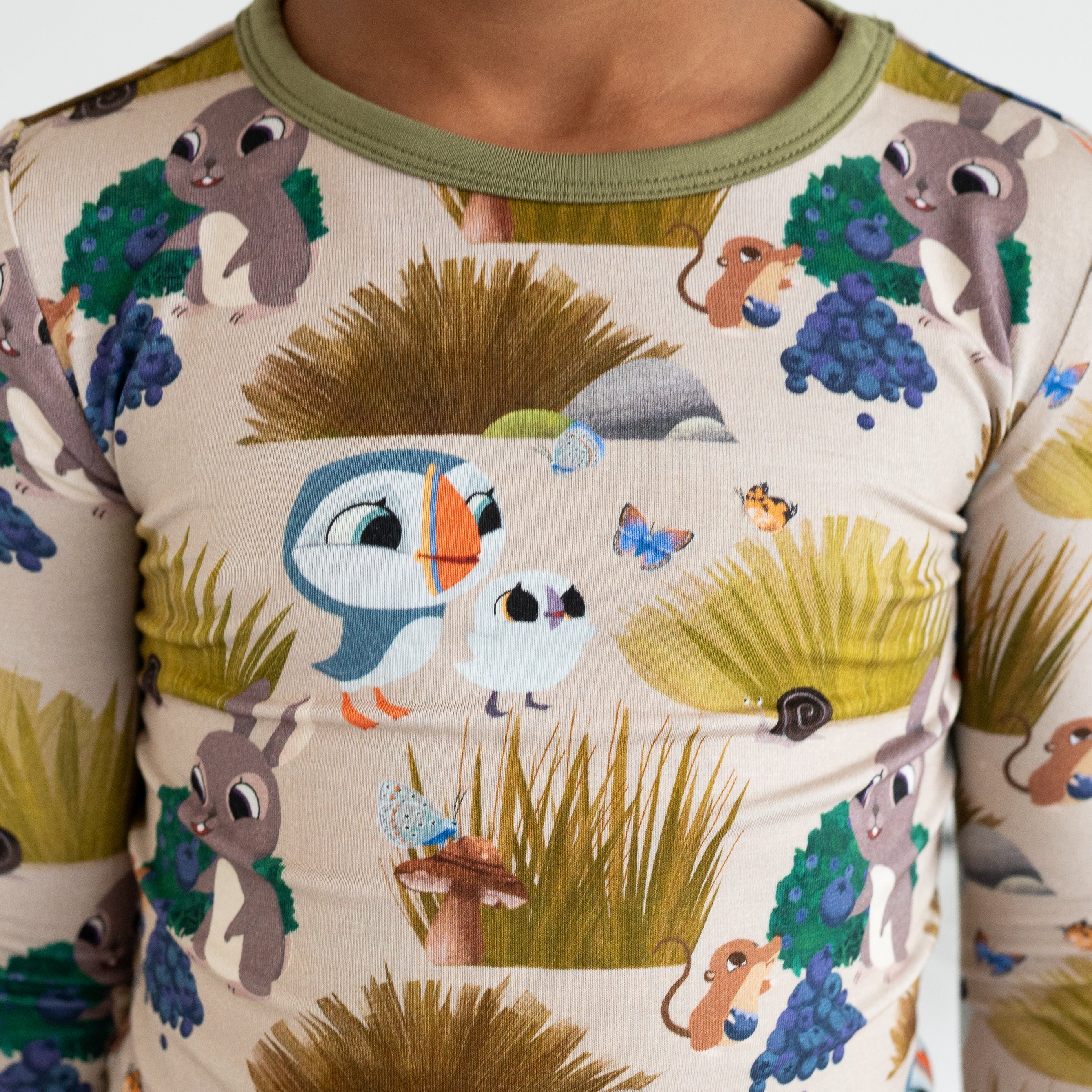 A long-sleeved pajama set with a Puffin Rock™ woodland print.