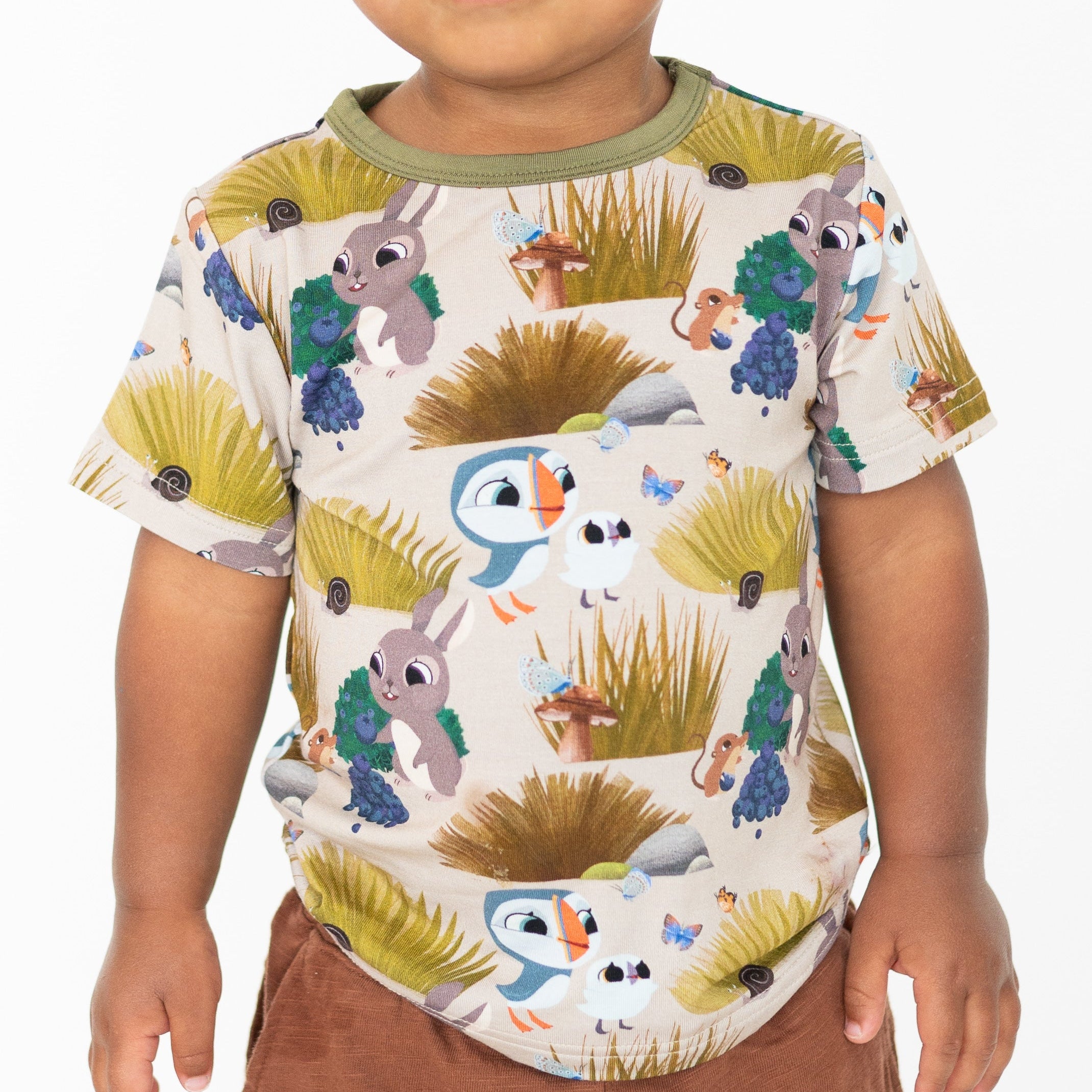 T-shirt with a Puffin Rock™ print featuring puffins, rabbits, and nature elements.