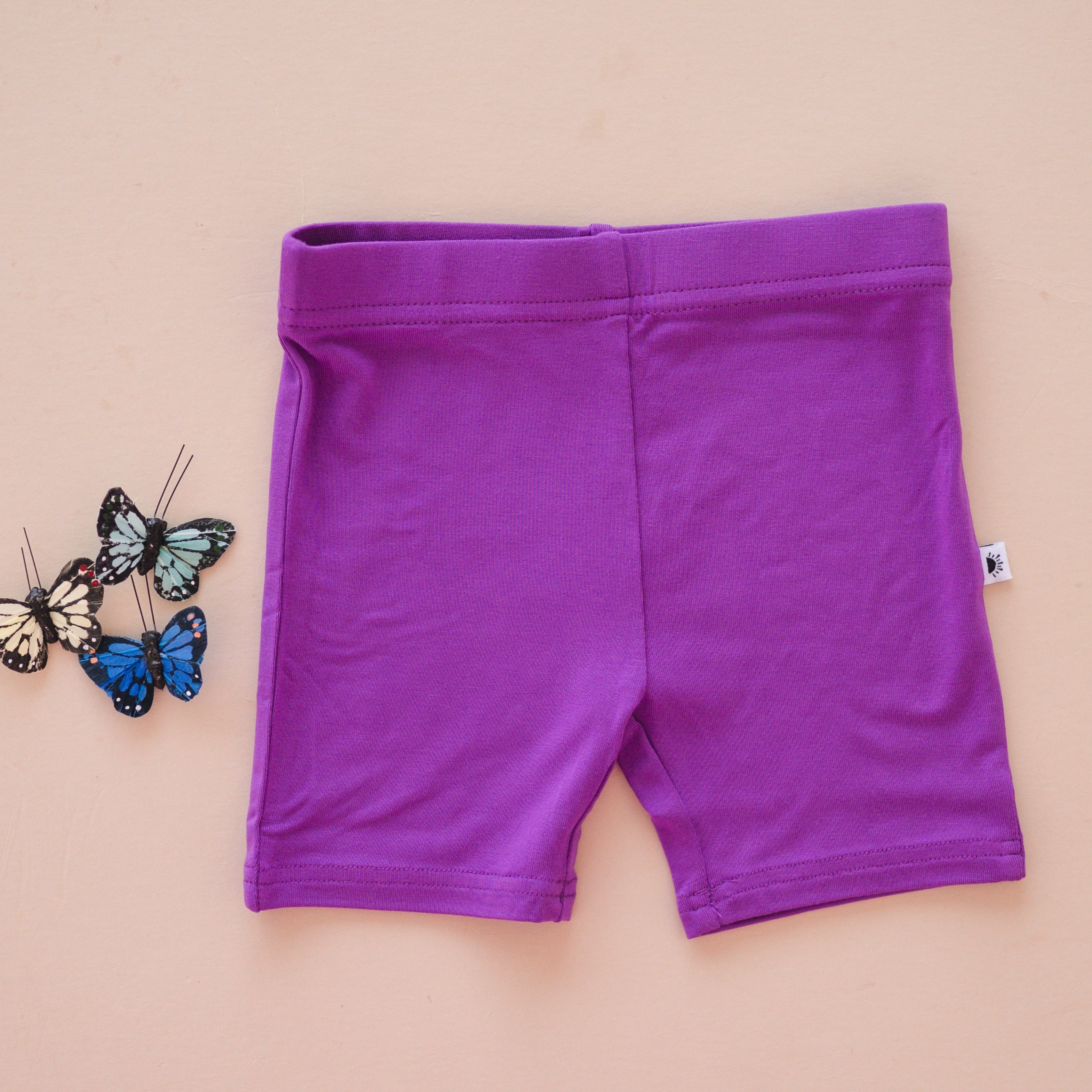 Purple bloom biker shorts made from luxe bamboo fabric.