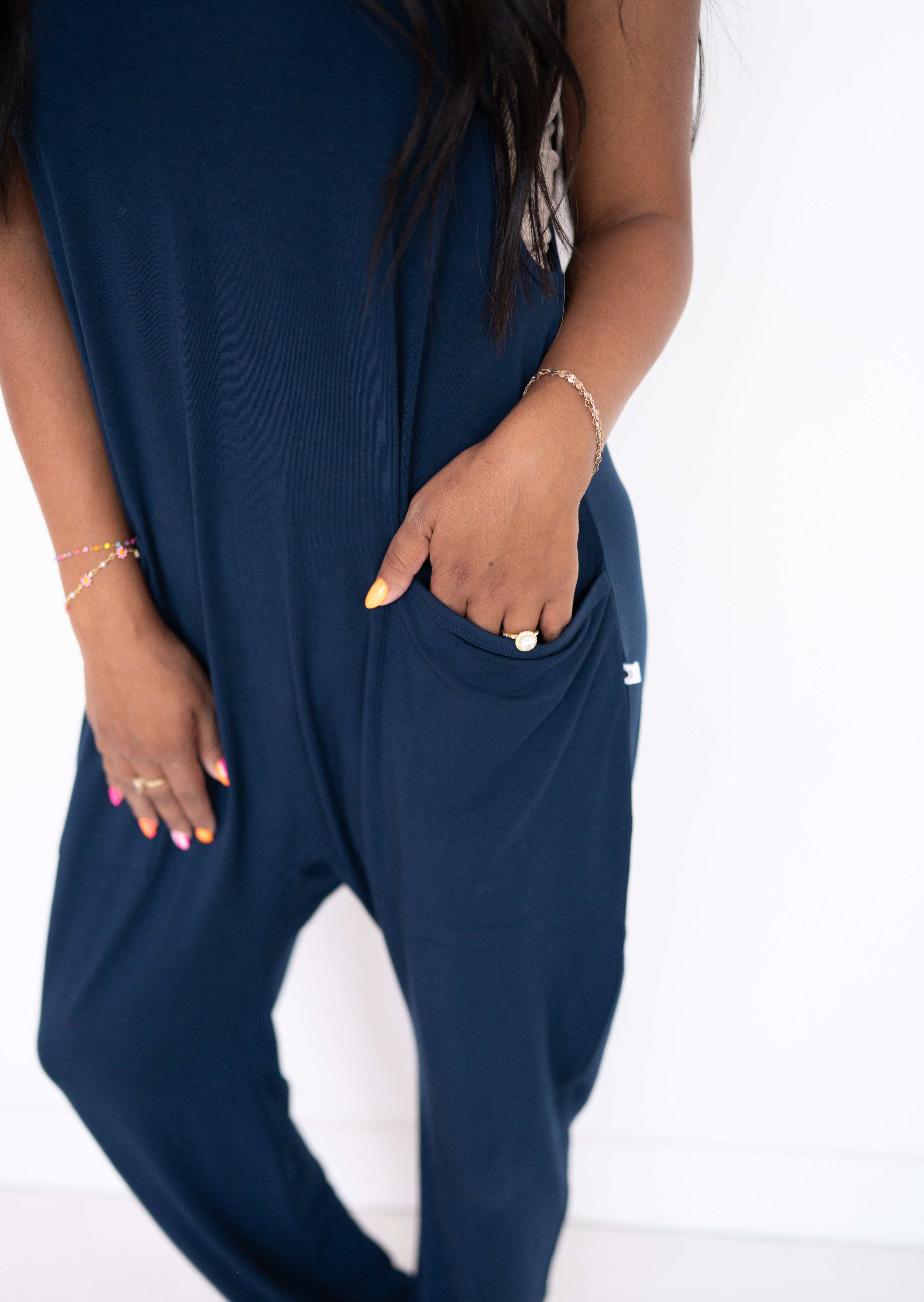 Adult navy overalls made of luxe bamboo with oversized pockets.