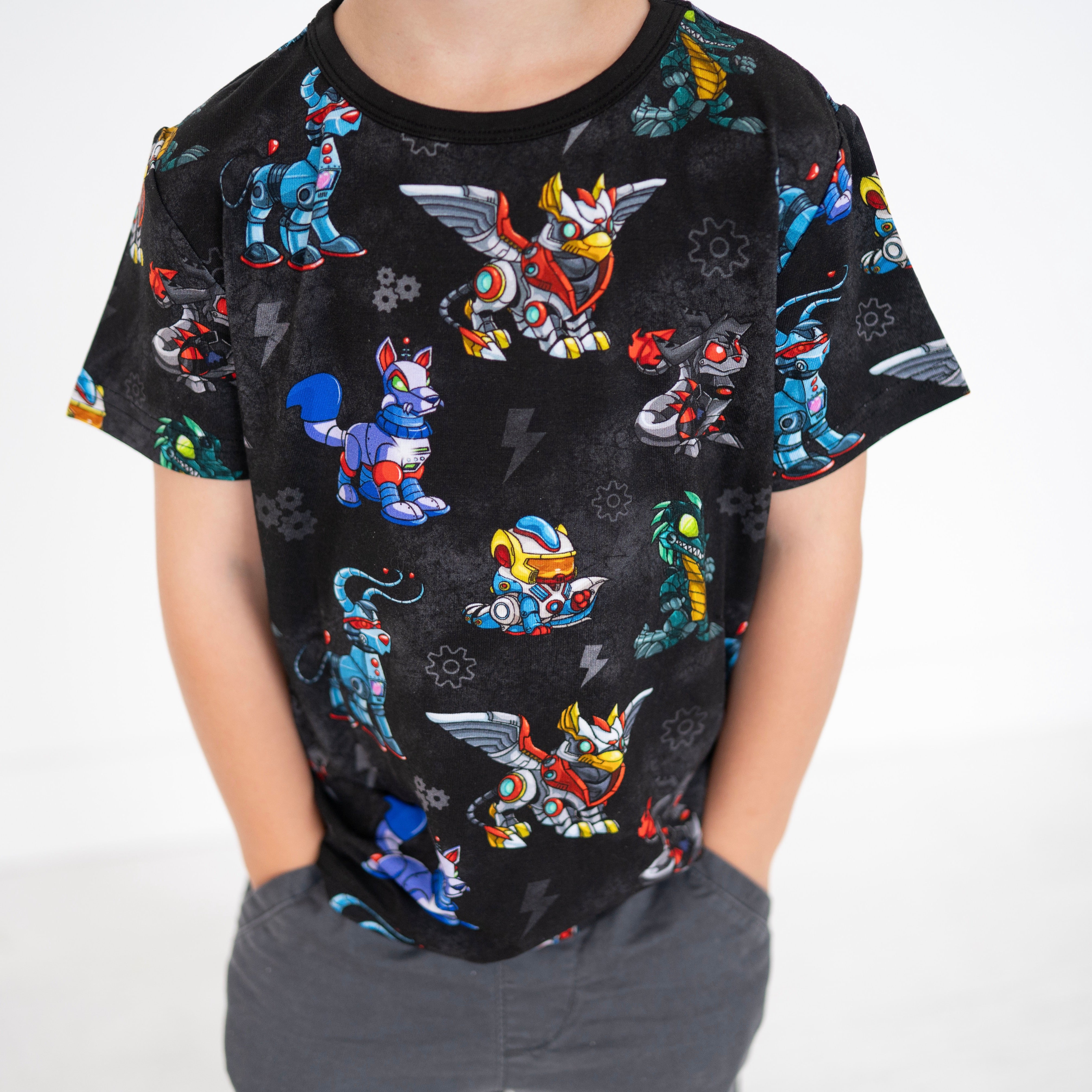 Black t-shirt with a repeating pattern of colorful robot characters.