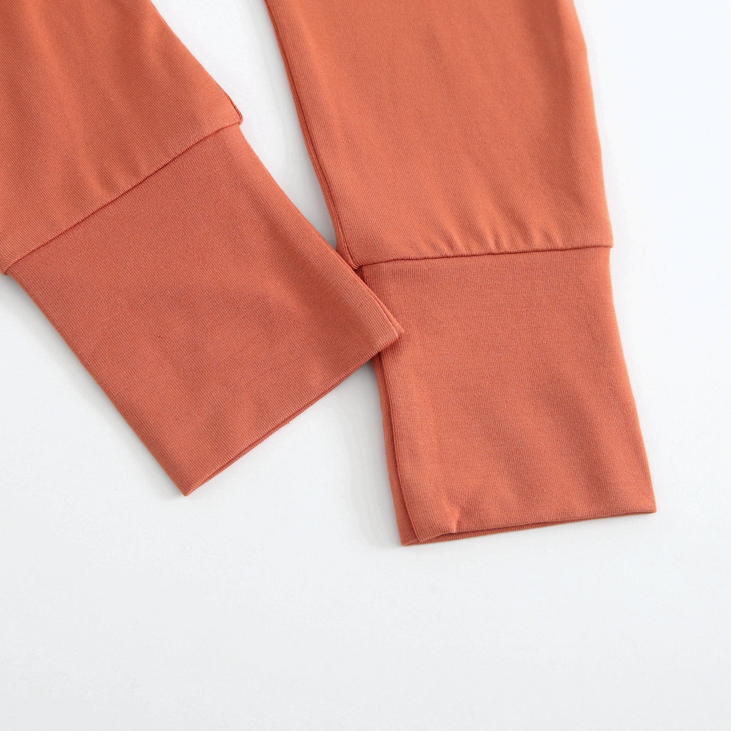 Rust colored bamboo pants with adjustable cuffs and waistband.