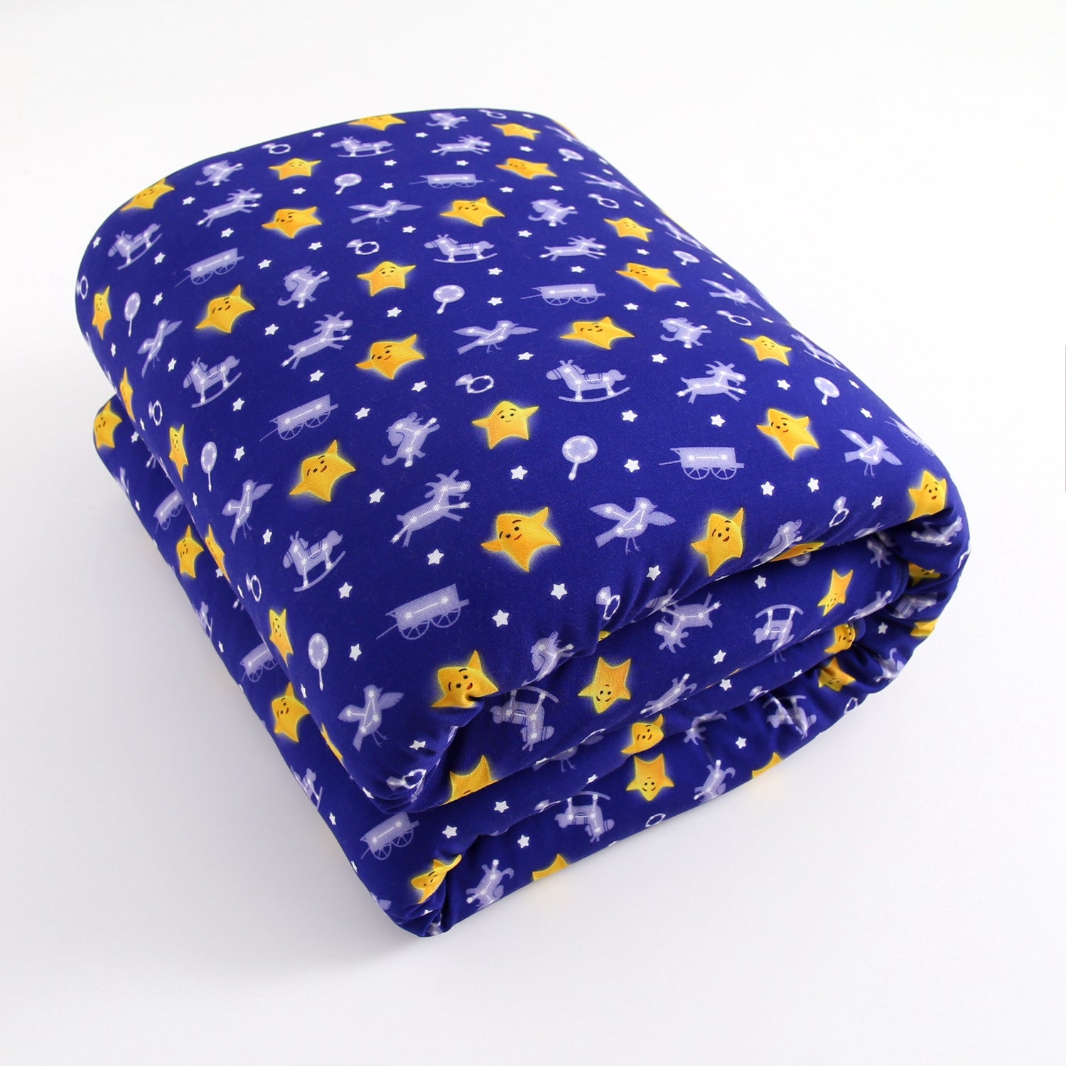 A folded blue blanket with a pattern of yellow stars and white rocking horses.