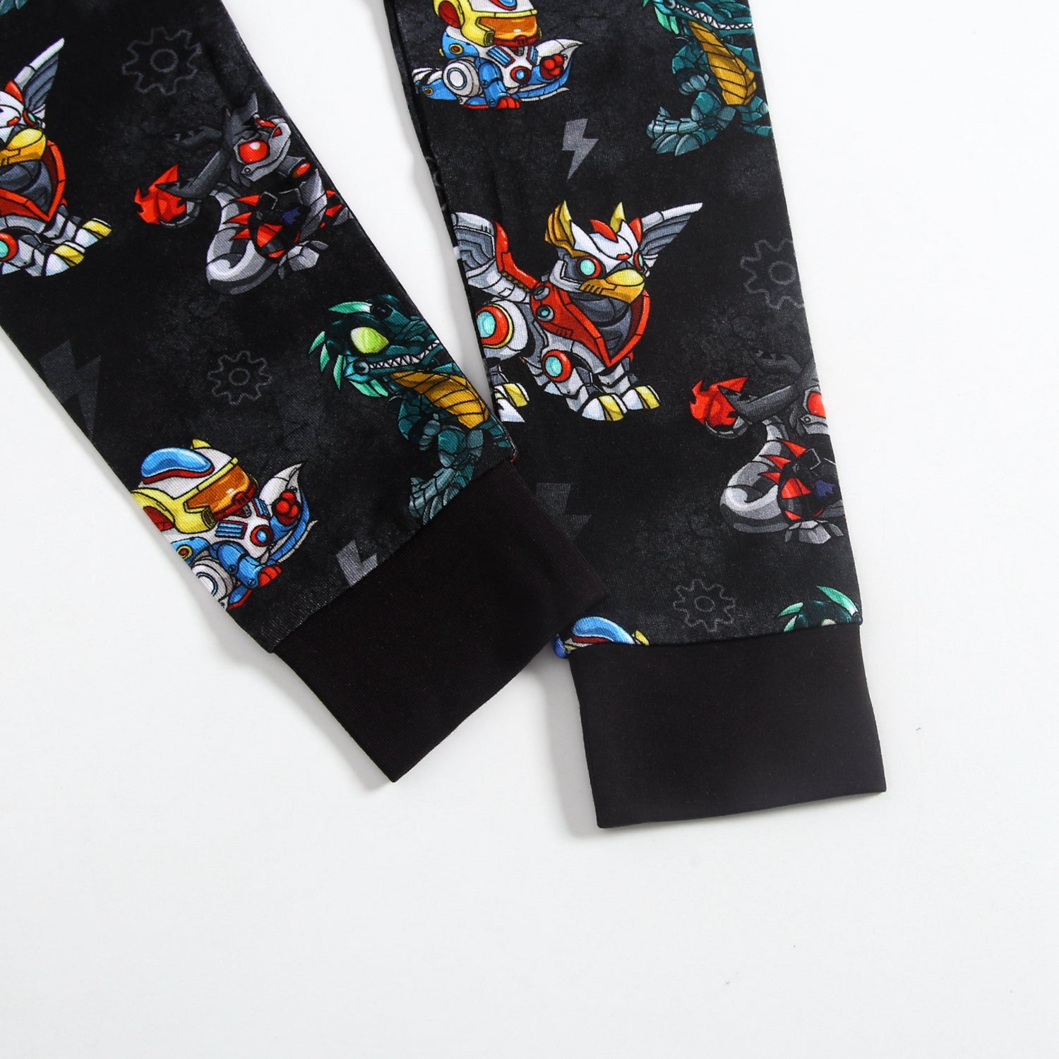 Black pajamas with a repeating pattern of colorful robot characters.