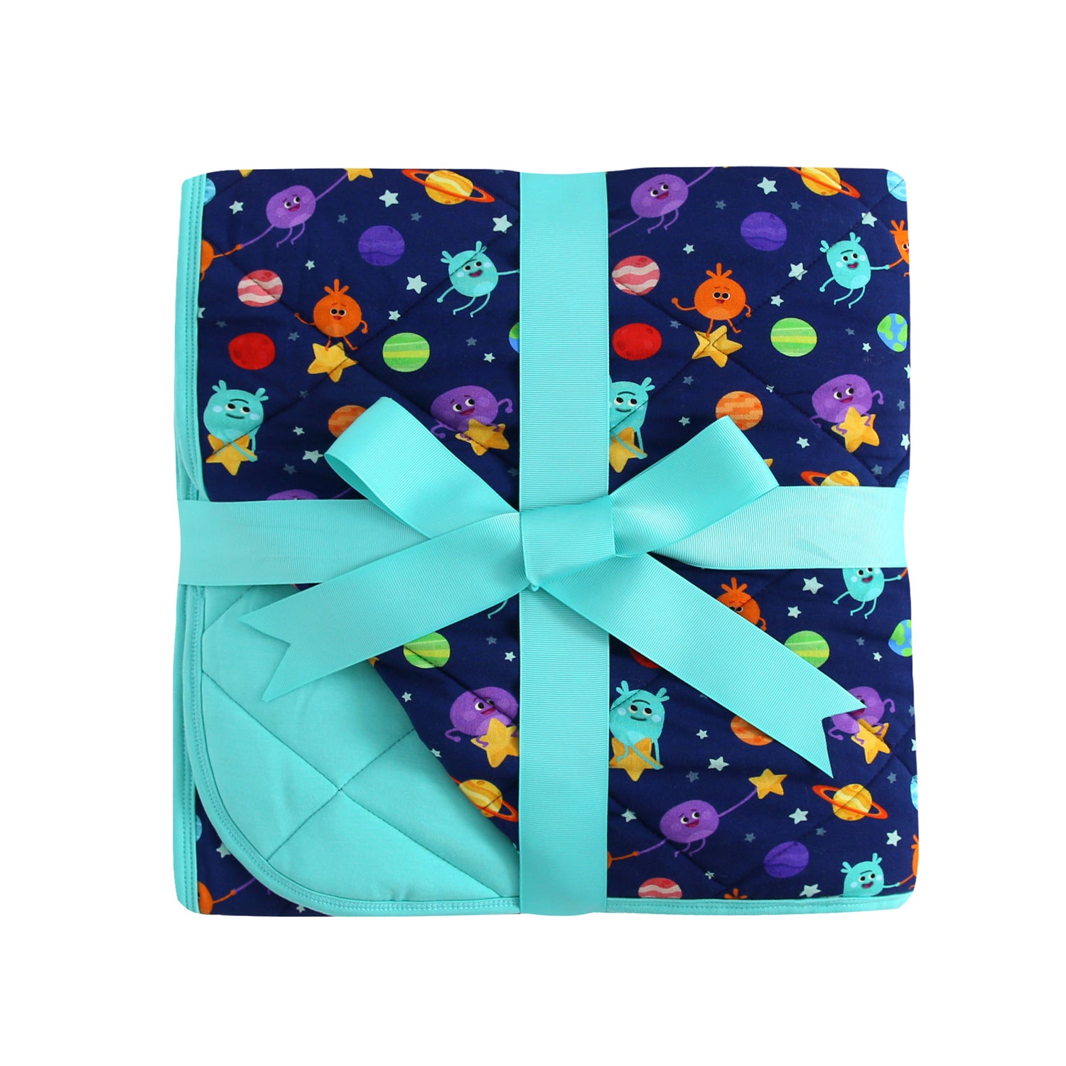 A quilted blanket with a space-themed print of cartoon aliens and planets, tied with a teal ribbon.
