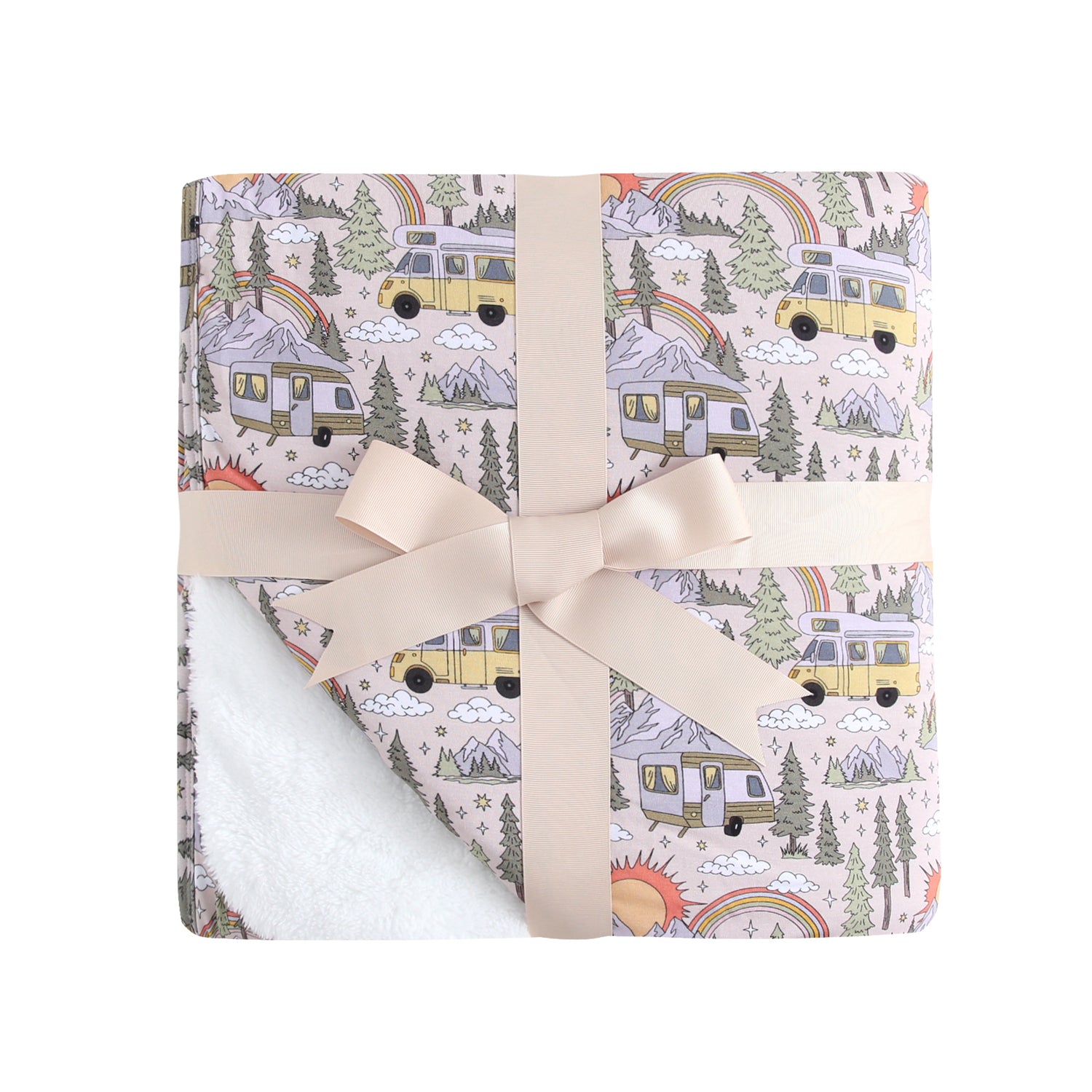 A plush blanket with a vintage camper pattern, tied with a bow.