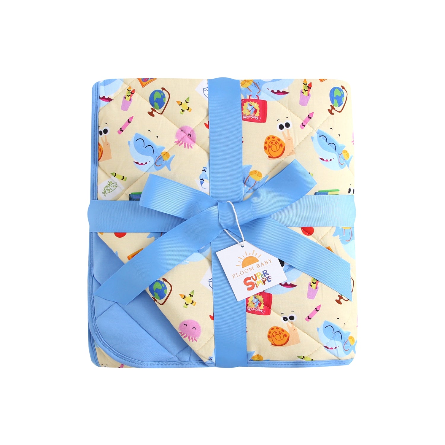A baby blanket with a shark and school supplies print, tied with a blue ribbon.
