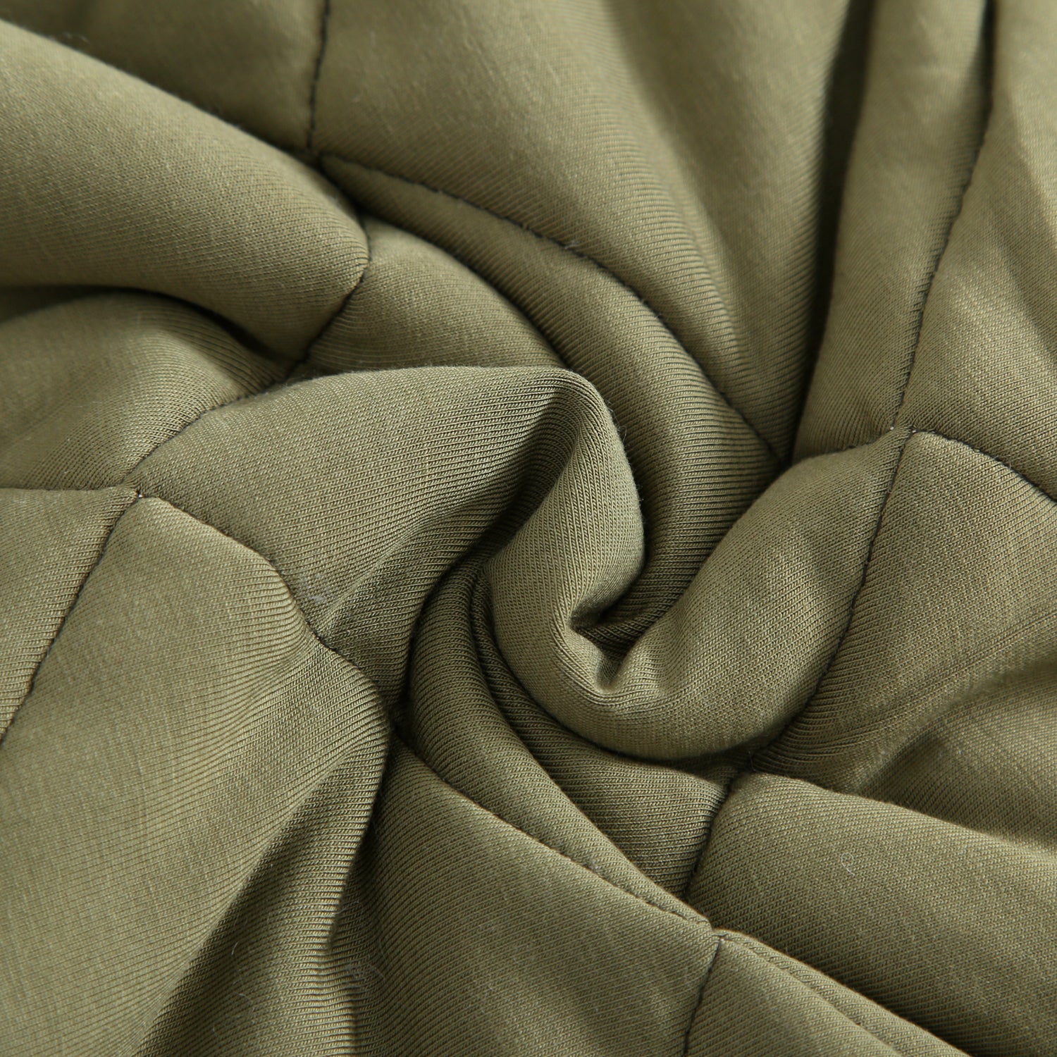 Quilted bamboo fabric in a swirling pattern.