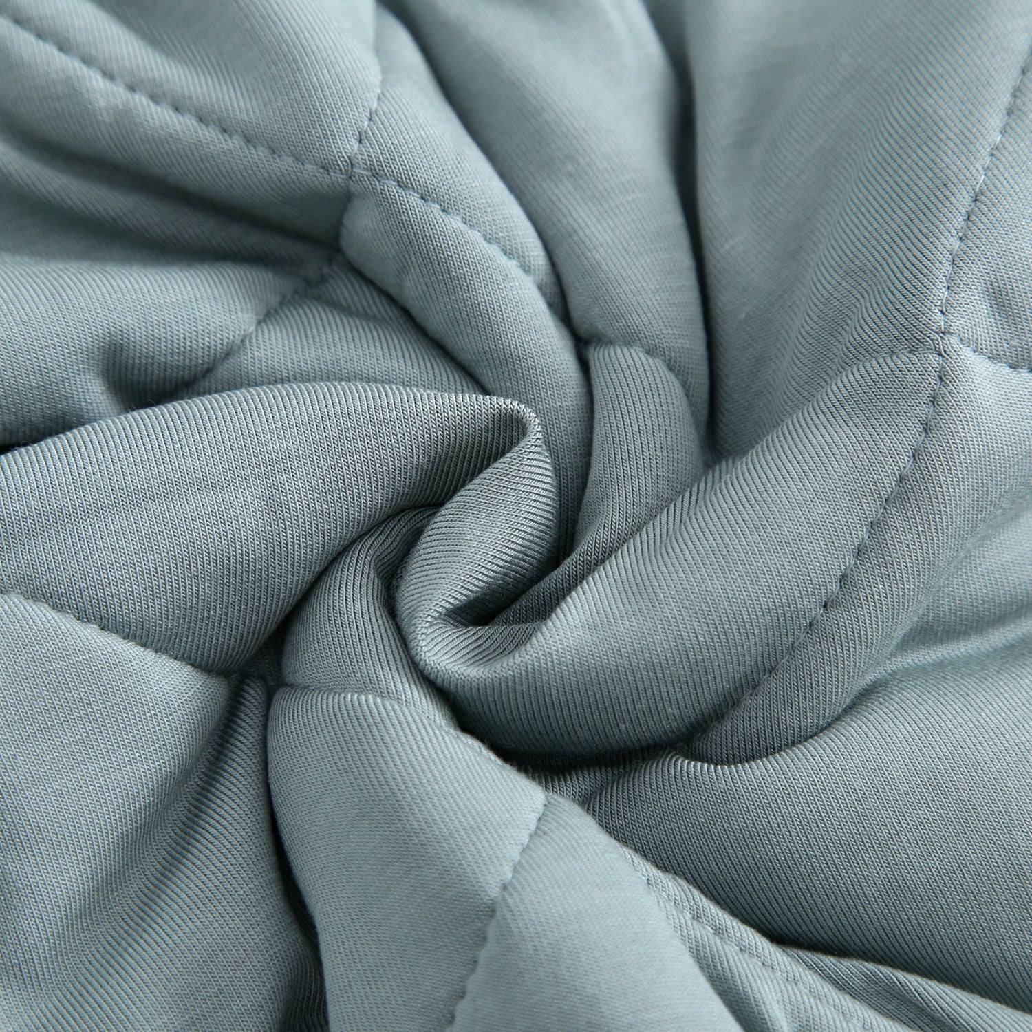 Quilted bamboo fabric in a swirling pattern.
