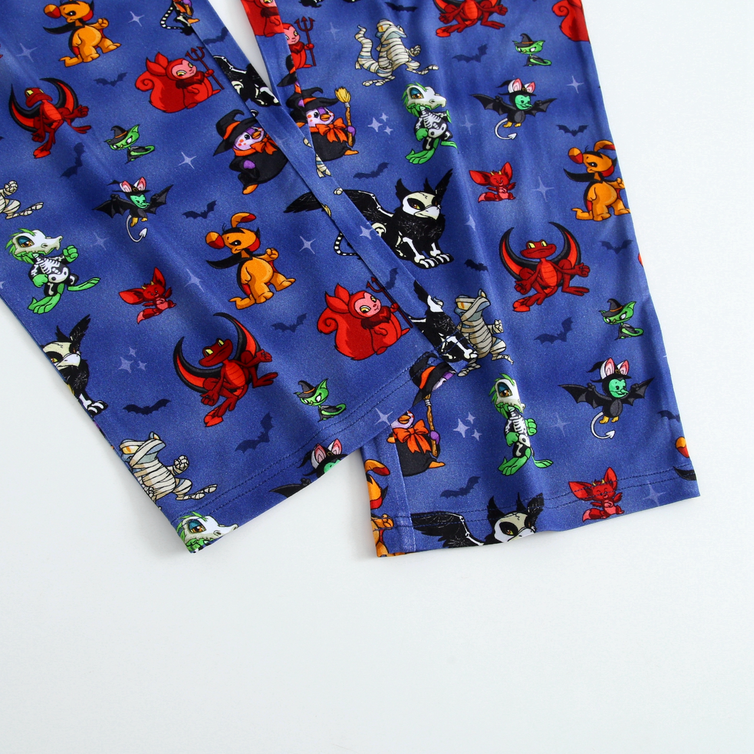 Blue unisex sleep pants with a Halloween Neopets print.