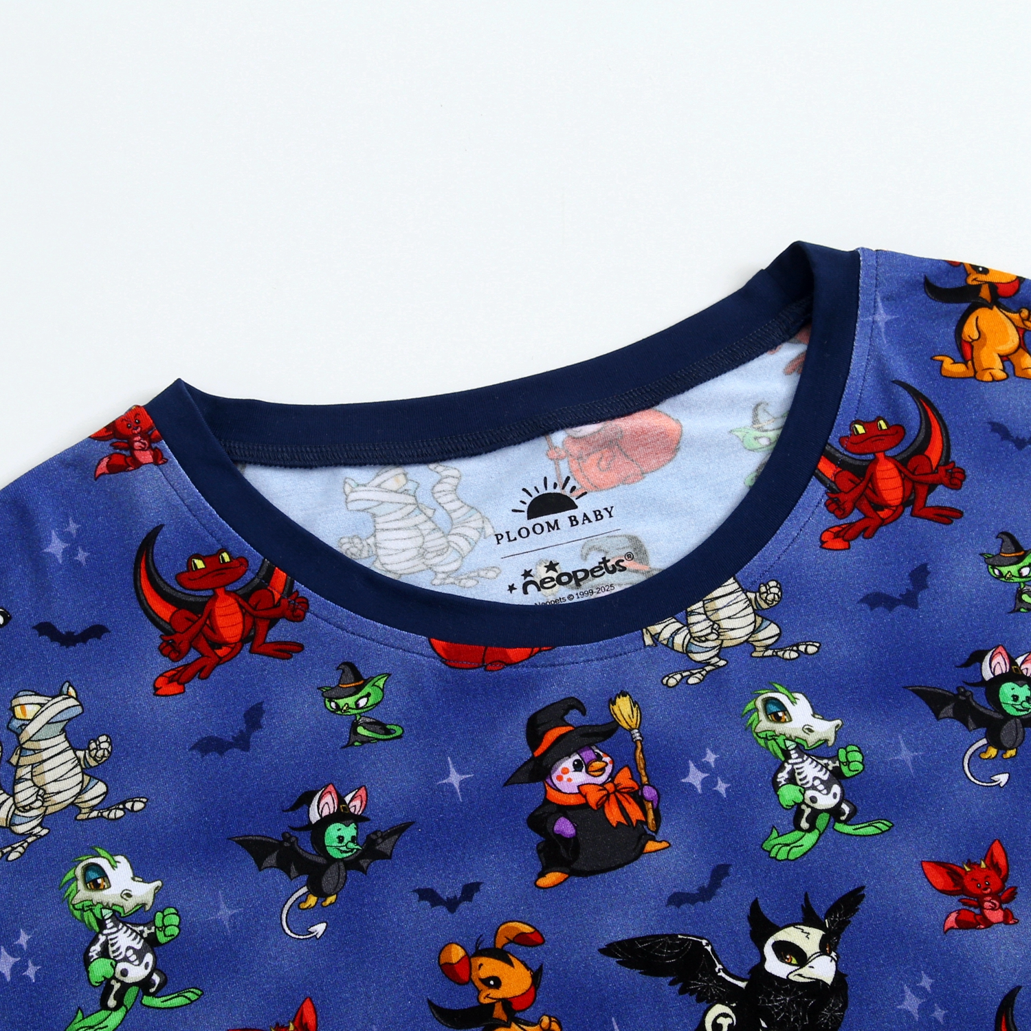 Blue Neopets Halloween print sleep tee with various characters.