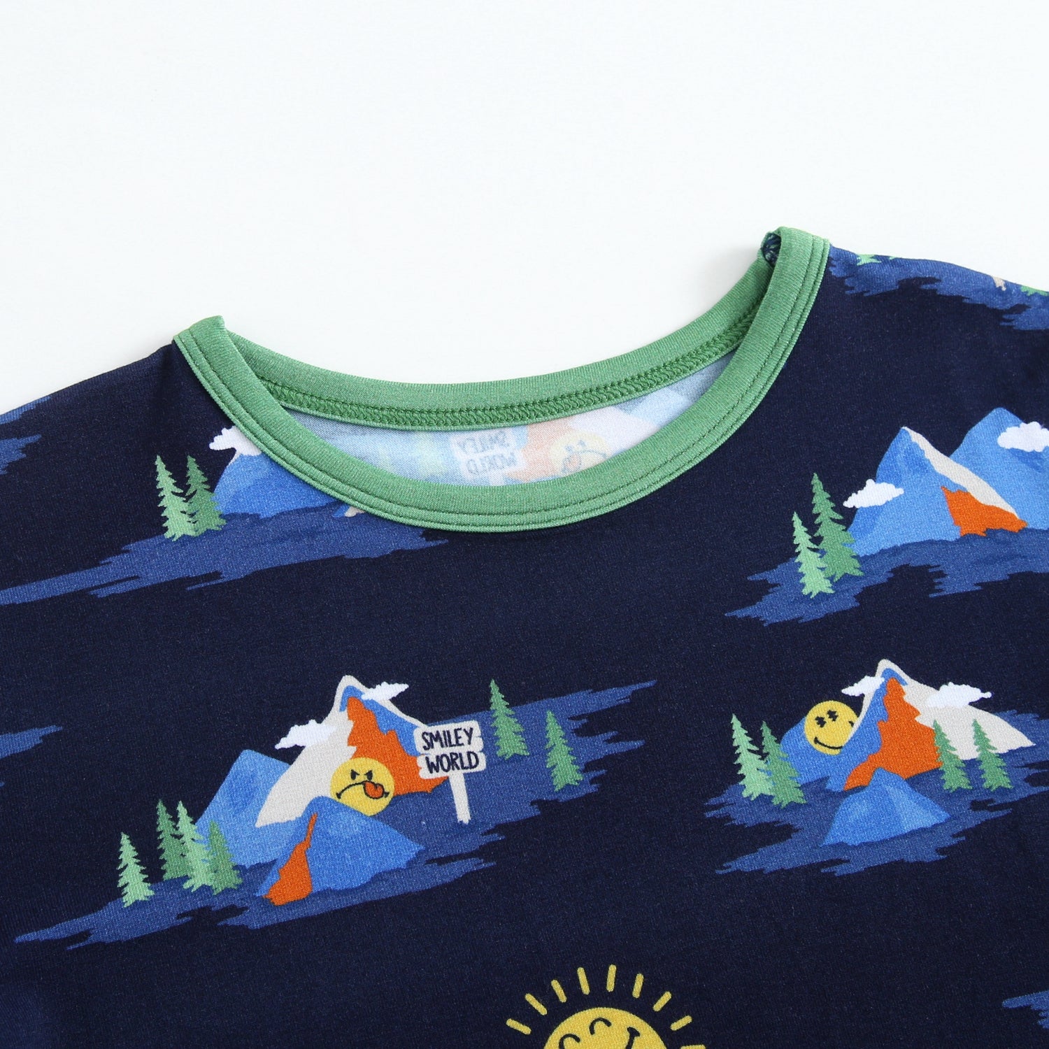 Navy t-shirt with a mountain and smiley face print.