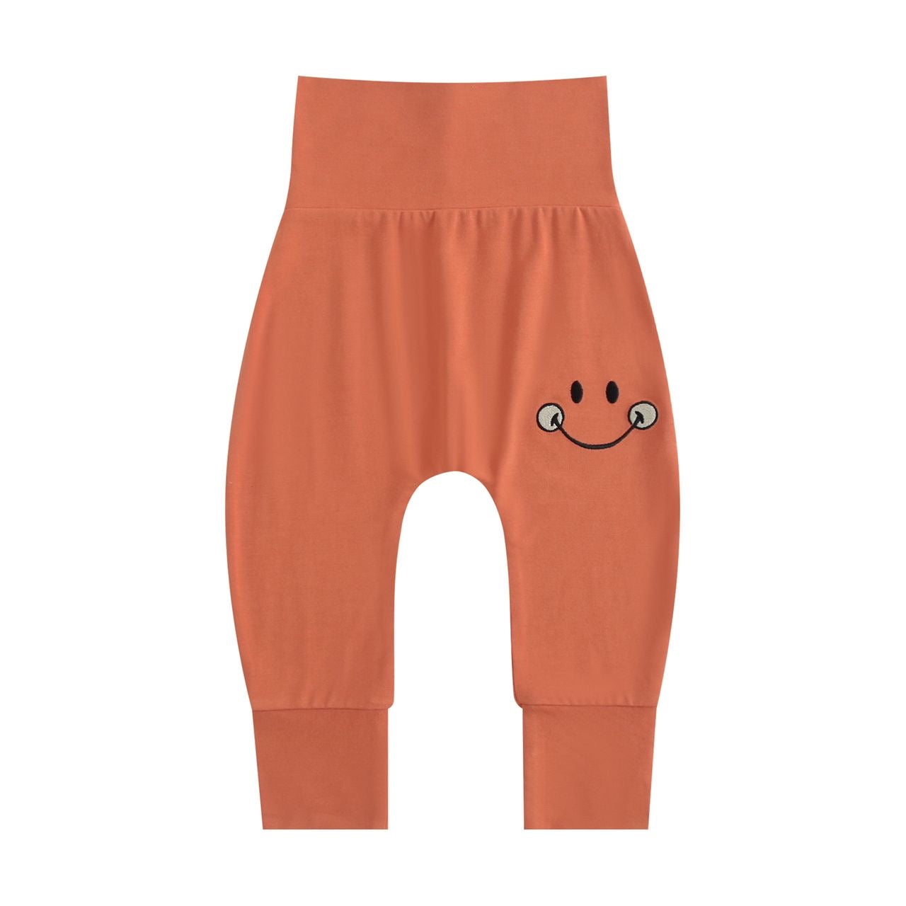 Orange bamboo pants with a happy smiley face design.