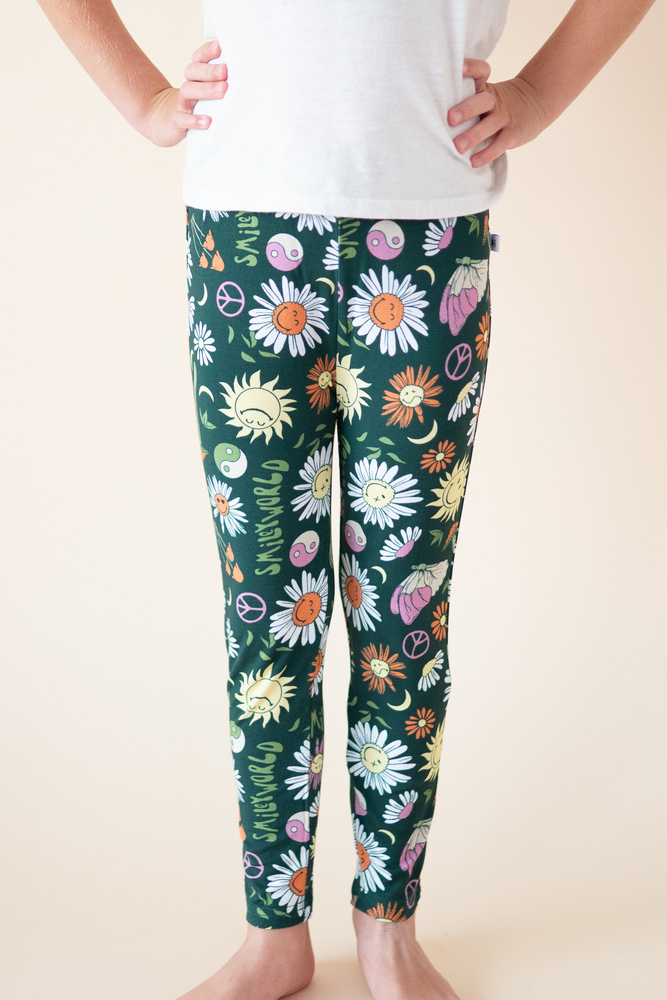 Green leggings with a SmileyWorld floral print.