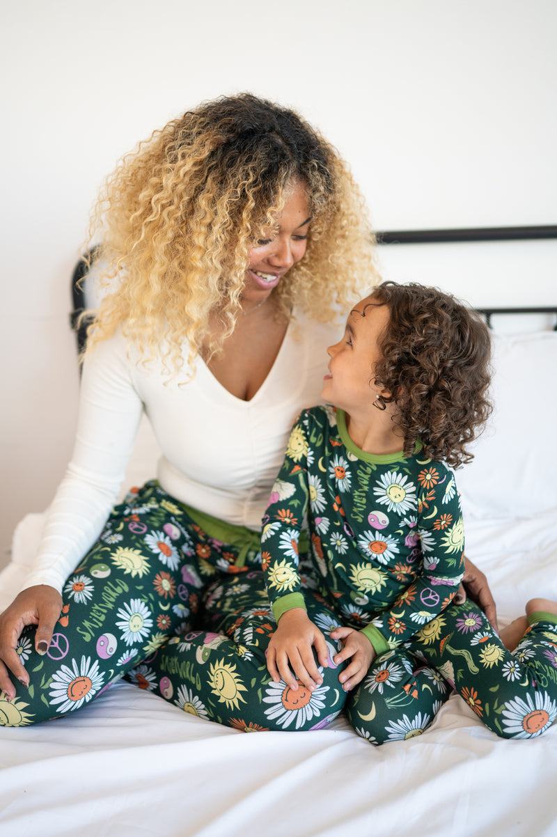Women's green joggers with a groovy floral SmileyWorld print.