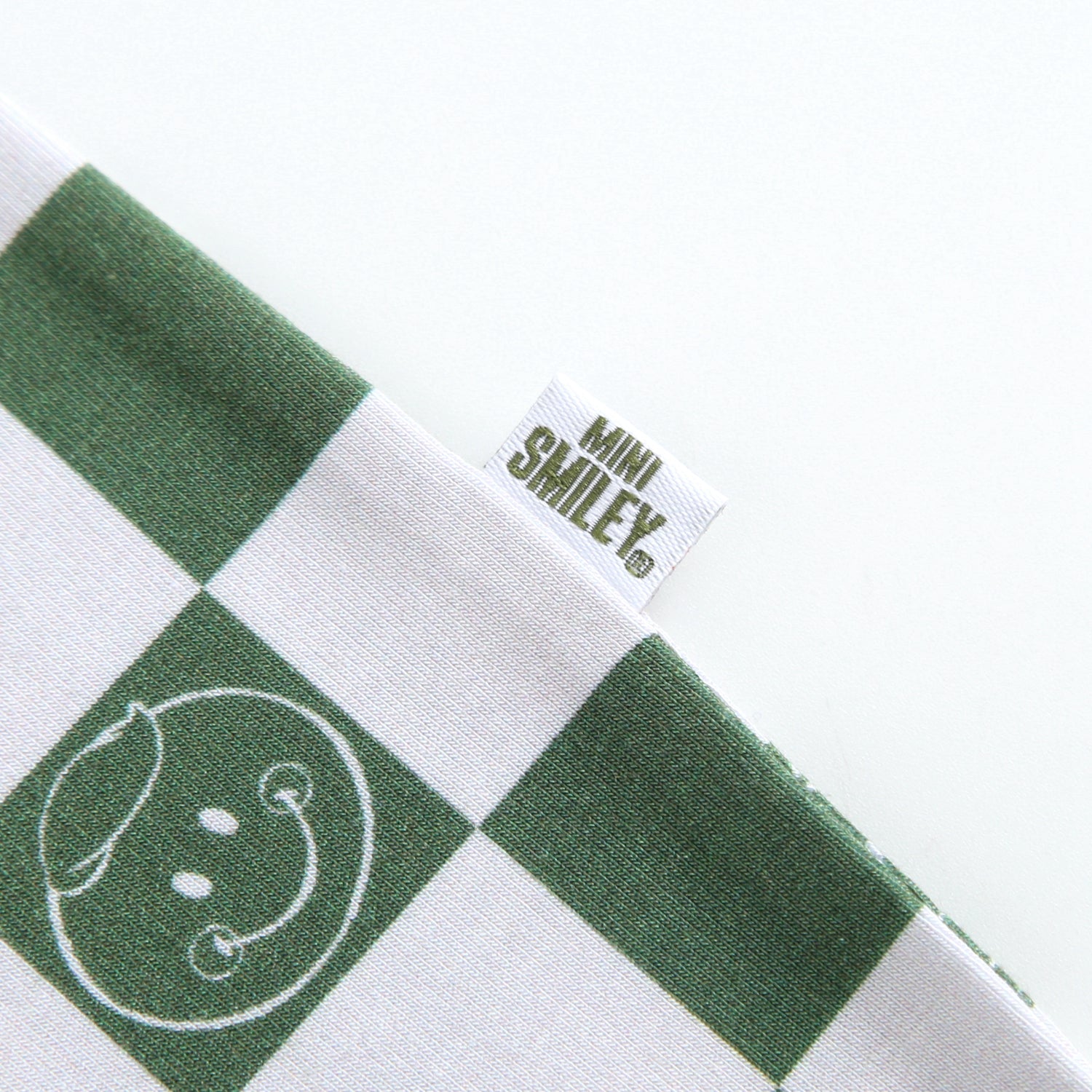 A green and white checkered bamboo pajama with a Mini Smiley tag.