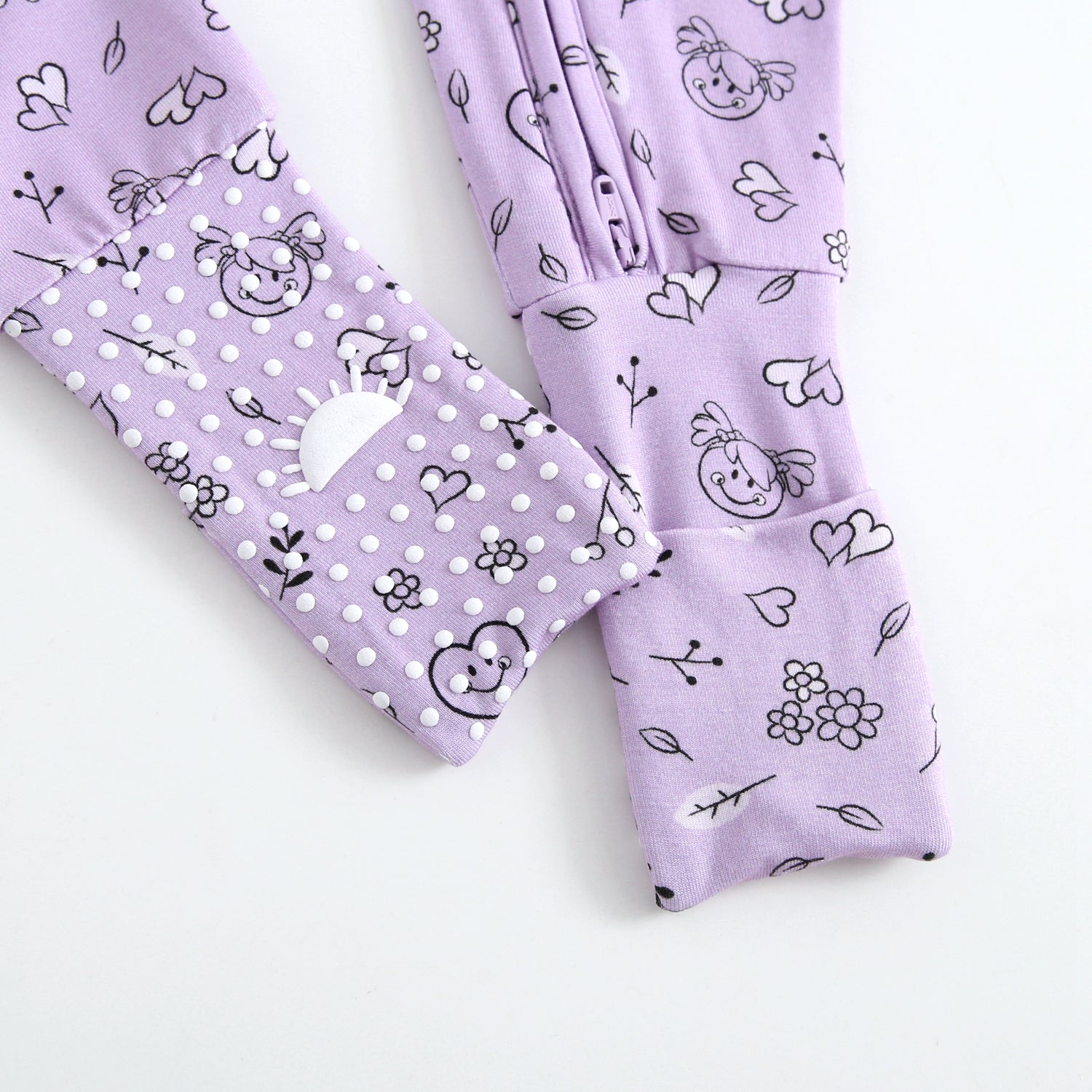 Lilac bamboo pajamas with a doodle print and grippy feet.