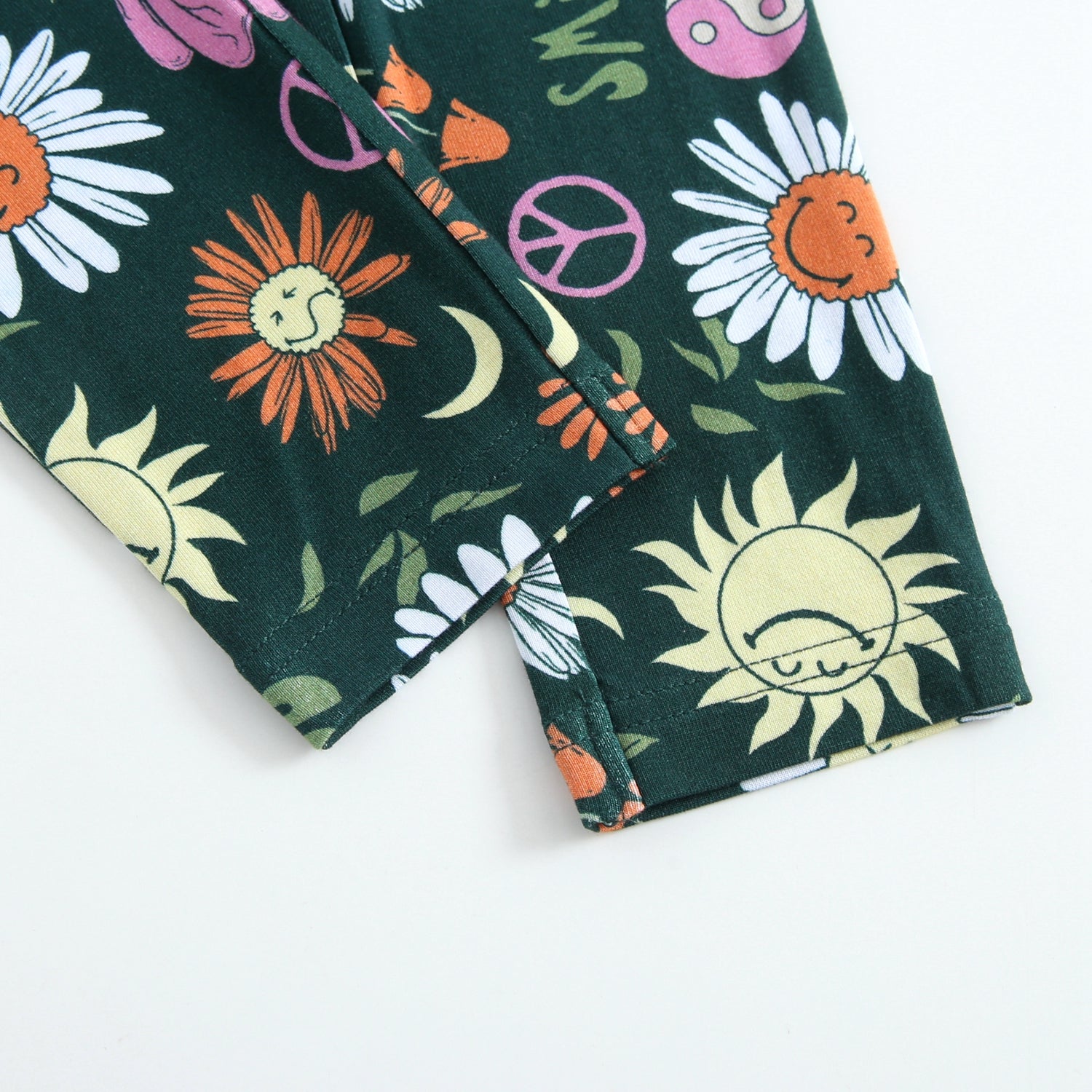 Green leggings with a groovy floral SmileyWorld print.