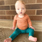 Long sleeve bamboo bodysuit by Ploom Baby for your little one.